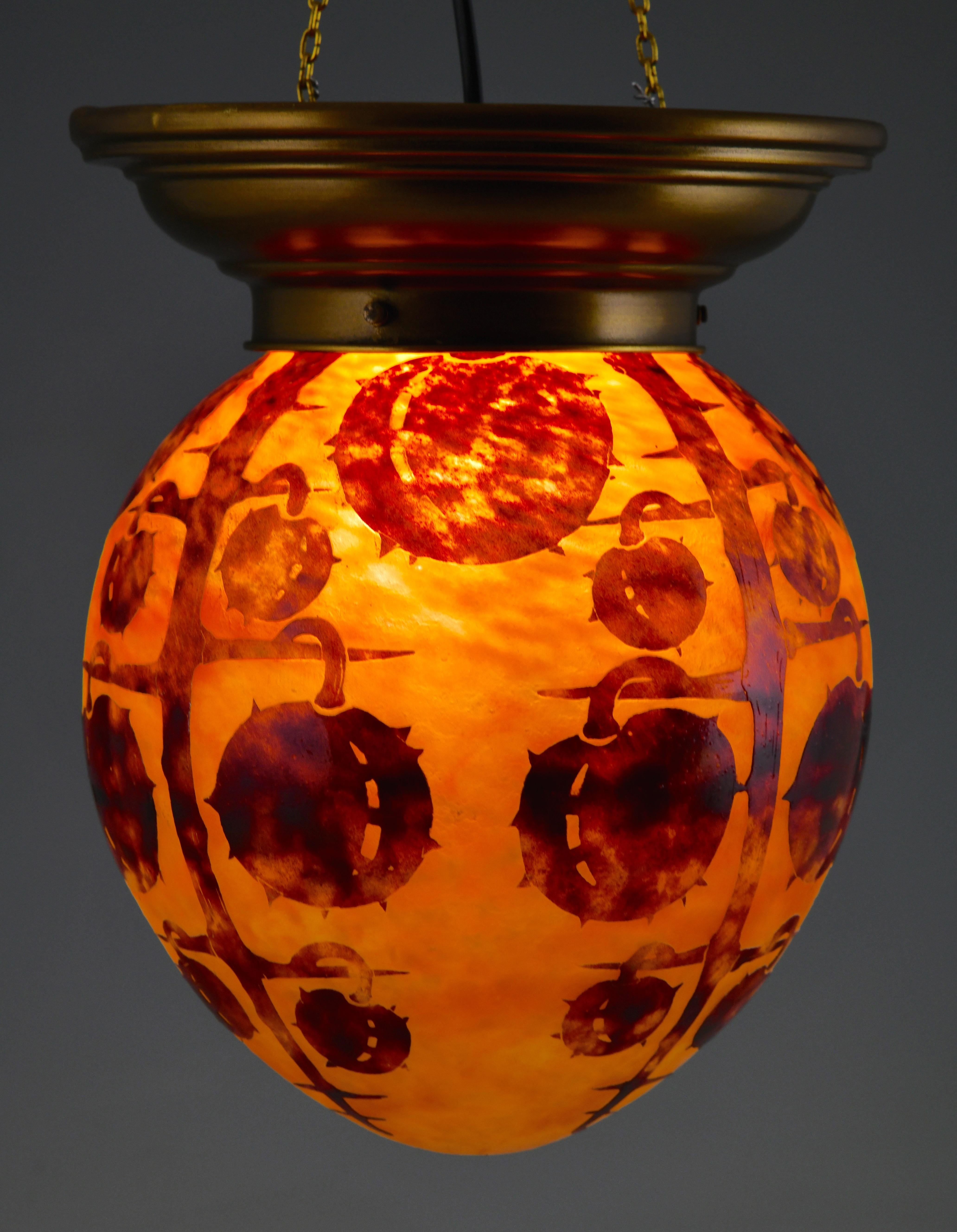 Marrons, Art Deco Cameo glass ceiling light by Charles Schneider for Le Verre Français.
France 1922-1925. 
Colors: Orange & brown cameo glass with a copper frame.

The same design is illustrated in 
Schneider Maître verrier, Gerard Betrand &
Charles