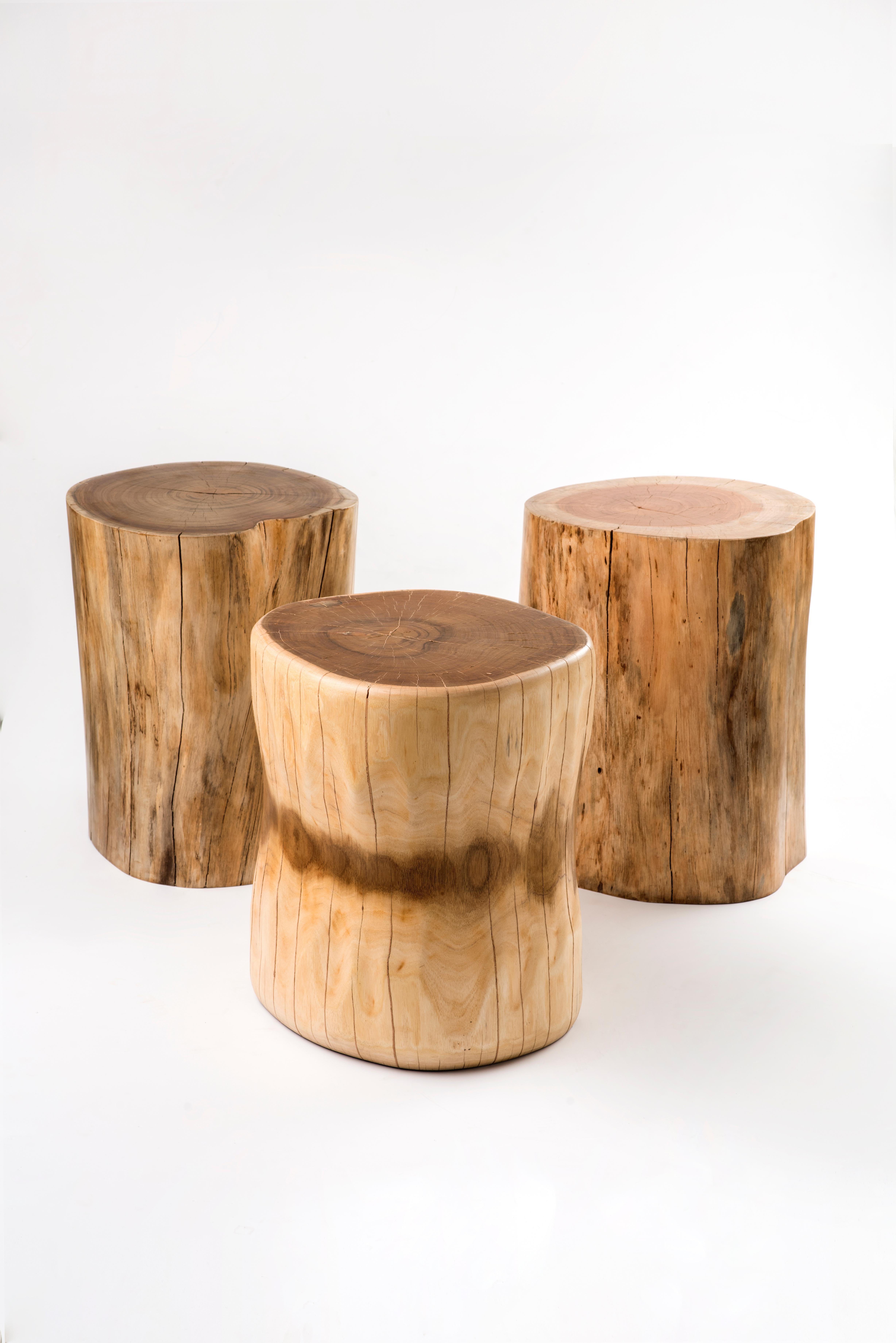 The Marrow Carved Solid Wooden Stump by Kunaal Kyhaan is cut from a solid trunk of Acacia and carved to reveal the layers of the wood.
Can be used as a stool or side table. 

Solid Wood. 