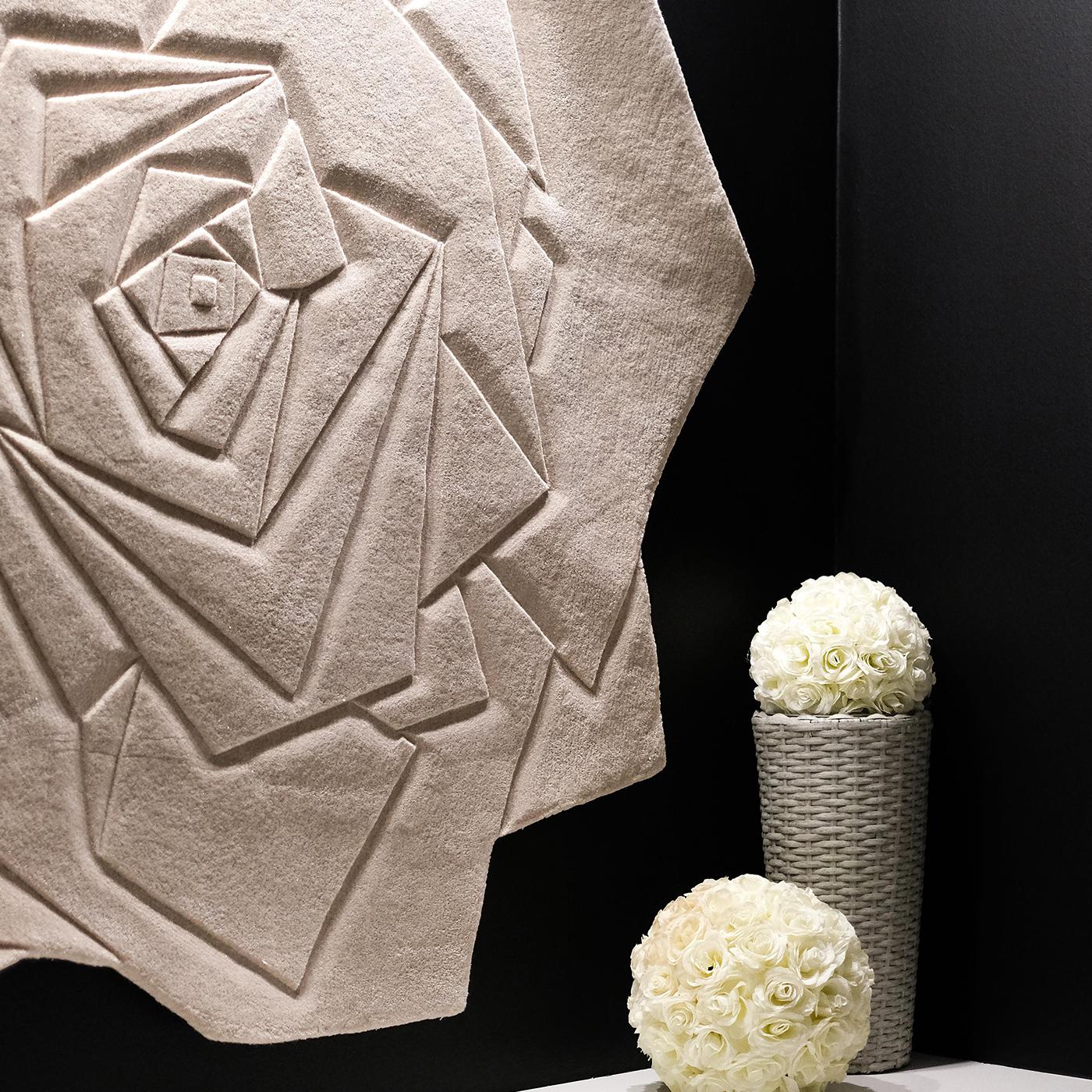 Hand-tufted and enriched with high-quality lurex yarns, the Marry Me rug mirrors a white rose corolla. It is the perfect solution for every interior that needs a romantic touch and can also be hung on the wall as a feminine tapestry. 100% New