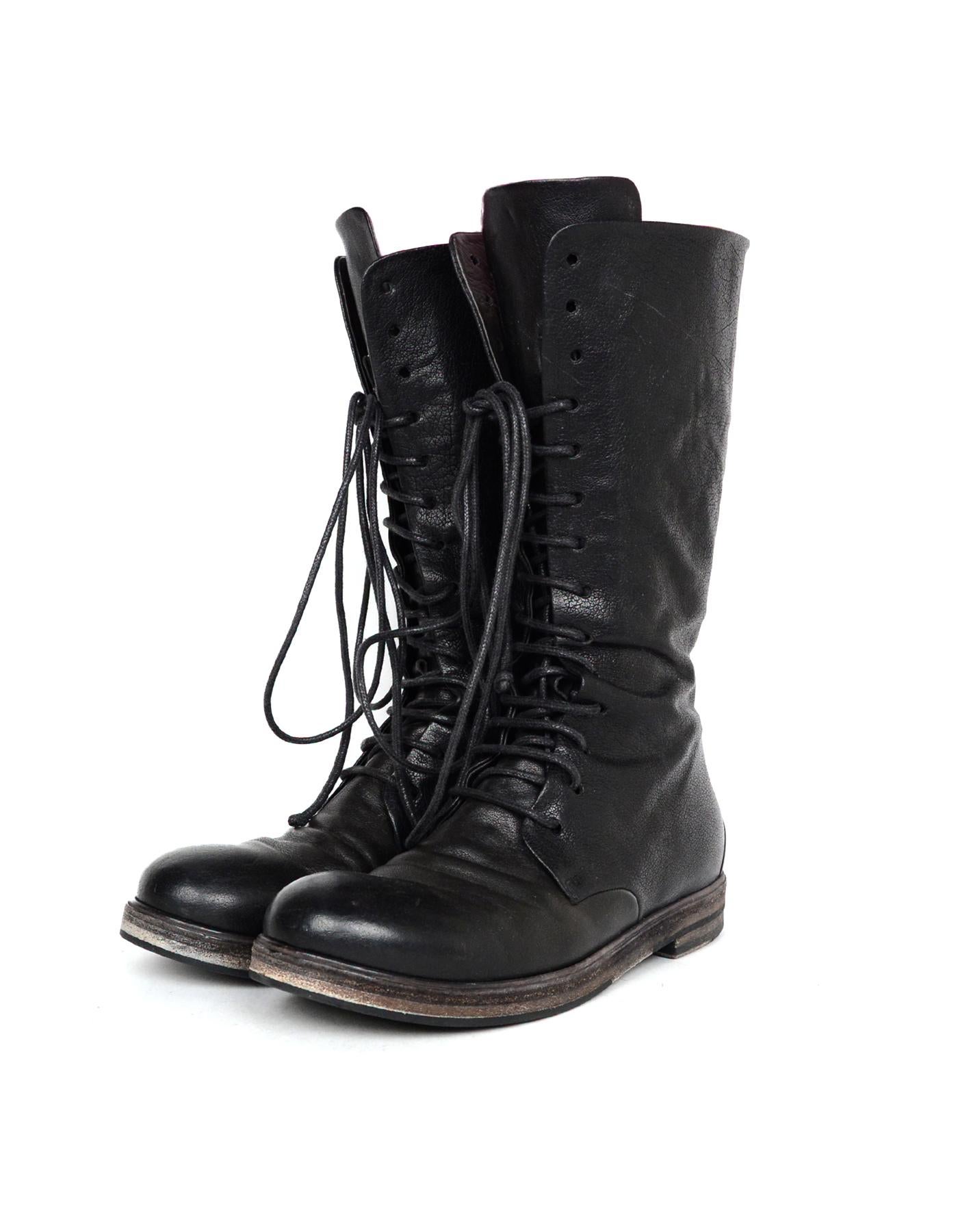 Marsell Black Leather Tall Lace Up Combat Boots Sz 37.5

Made In: Italy
Color: Black
Hardware: Antiqued silvertone
Materials: Leather, metal
Closure/Opening:  Rear zipper and front lace up
Overall Condition: Very good pre-owned condition with