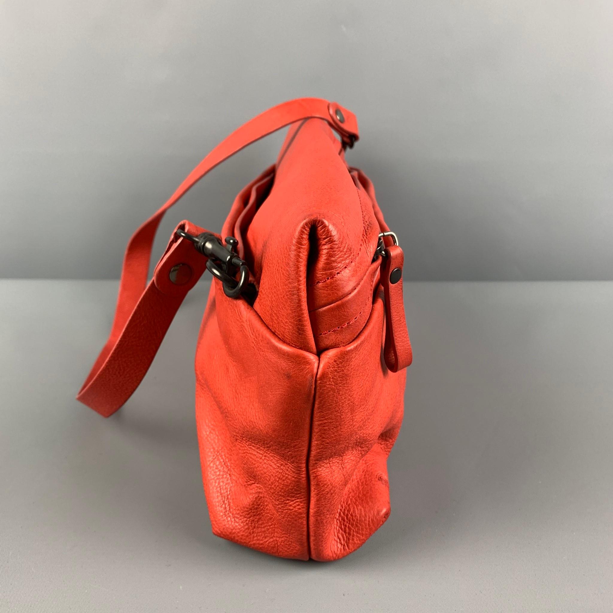 MARSELL bag comes in a coral leather featuring a rectangle design, detachable shoulder straps, inner pocket, and a zipper closure. Includes dust bag.

Very Good Pre-Owned Condition.

Measurements:

Length: 14 in.
Width: 3.5 in.
Height: 6 in.
Drop: