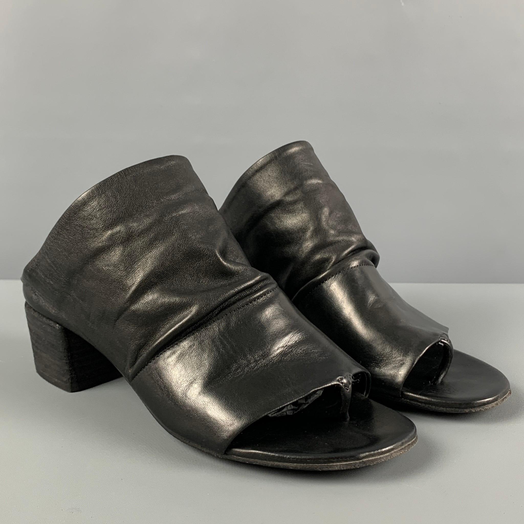 MARSELL sandals comes in a black leather featuring a peep toe style and a stacked heel. Includes box. Made in Italy.

Very Good Pre-Owned Condition.
Marked: 37
Original Retail Price: $575.00

Measurements:

Heel: 1.75 in. 
