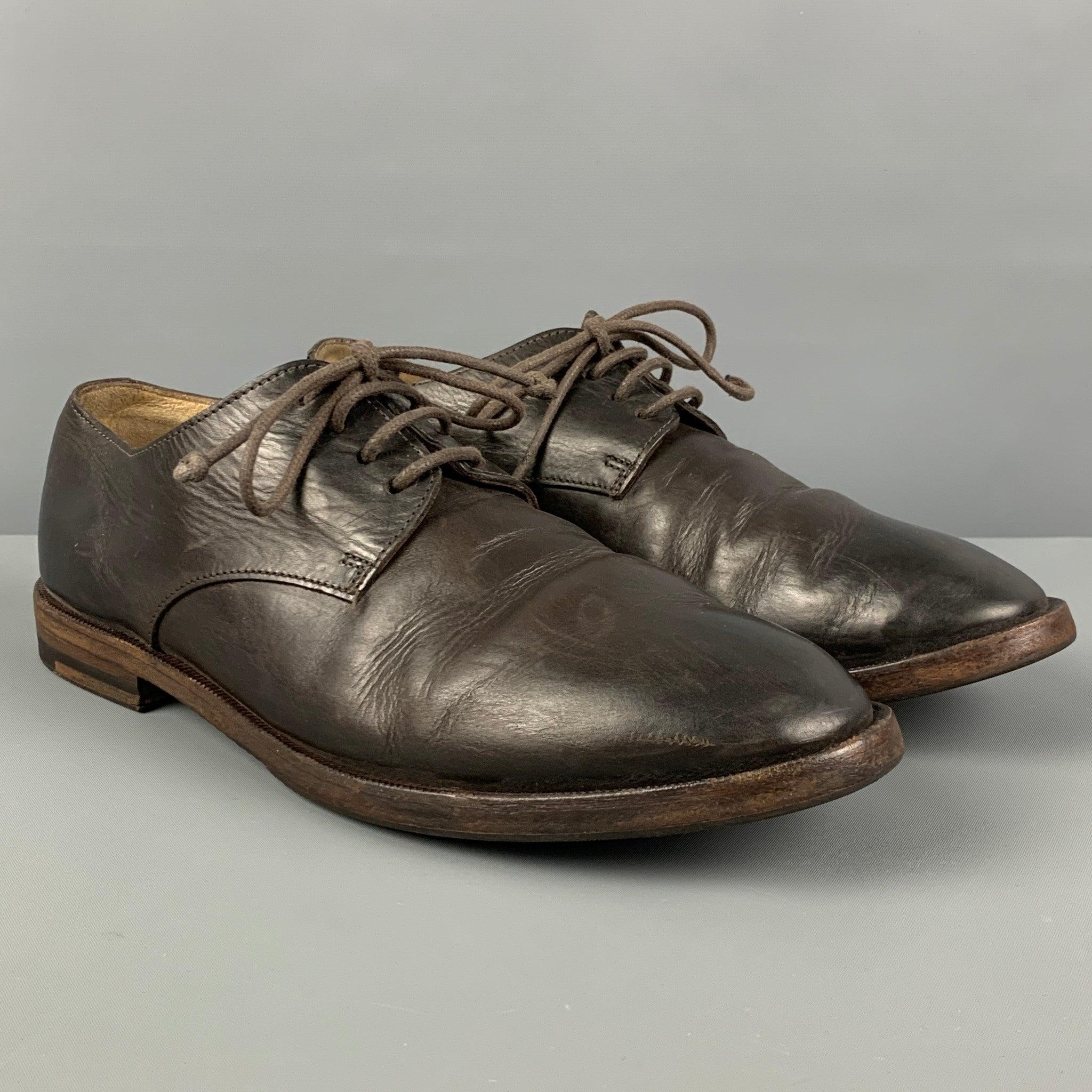 MARSELL shoes comes in a dark brown leather featuring a round toe and a lace up closure. Made in Italy.
Good
Pre-Owned Condition. Light wear. As-is.  

Marked:   41Outsole: 11.5 inches  x 4 inches 
  
  
 
Reference: 121896
Category: Lace Up