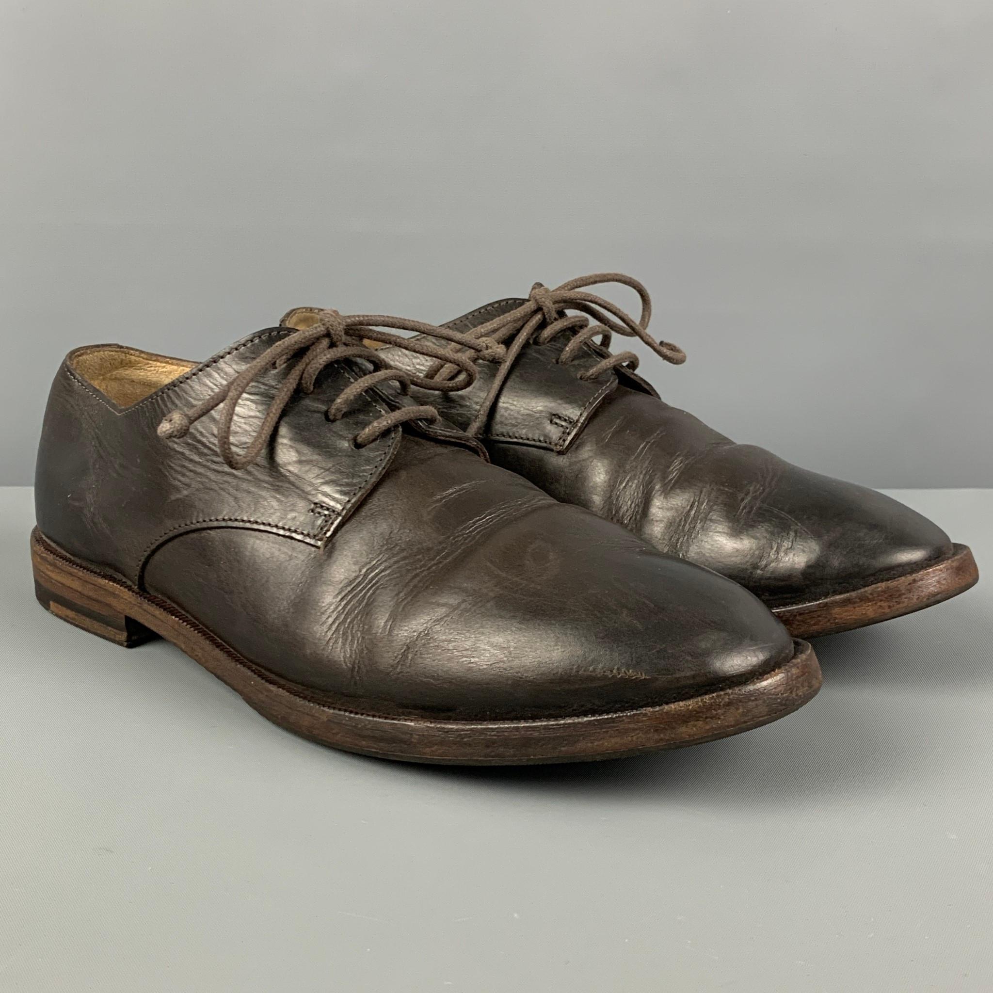 MARSELL shoes comes in a dark brown leather featuring a round toe and a lace up closure. Made in Italy. 

Good Pre-Owned Condition. Light wear. As-is.
Marked: 41

Outsole: 11.5 in. x 4 in. 