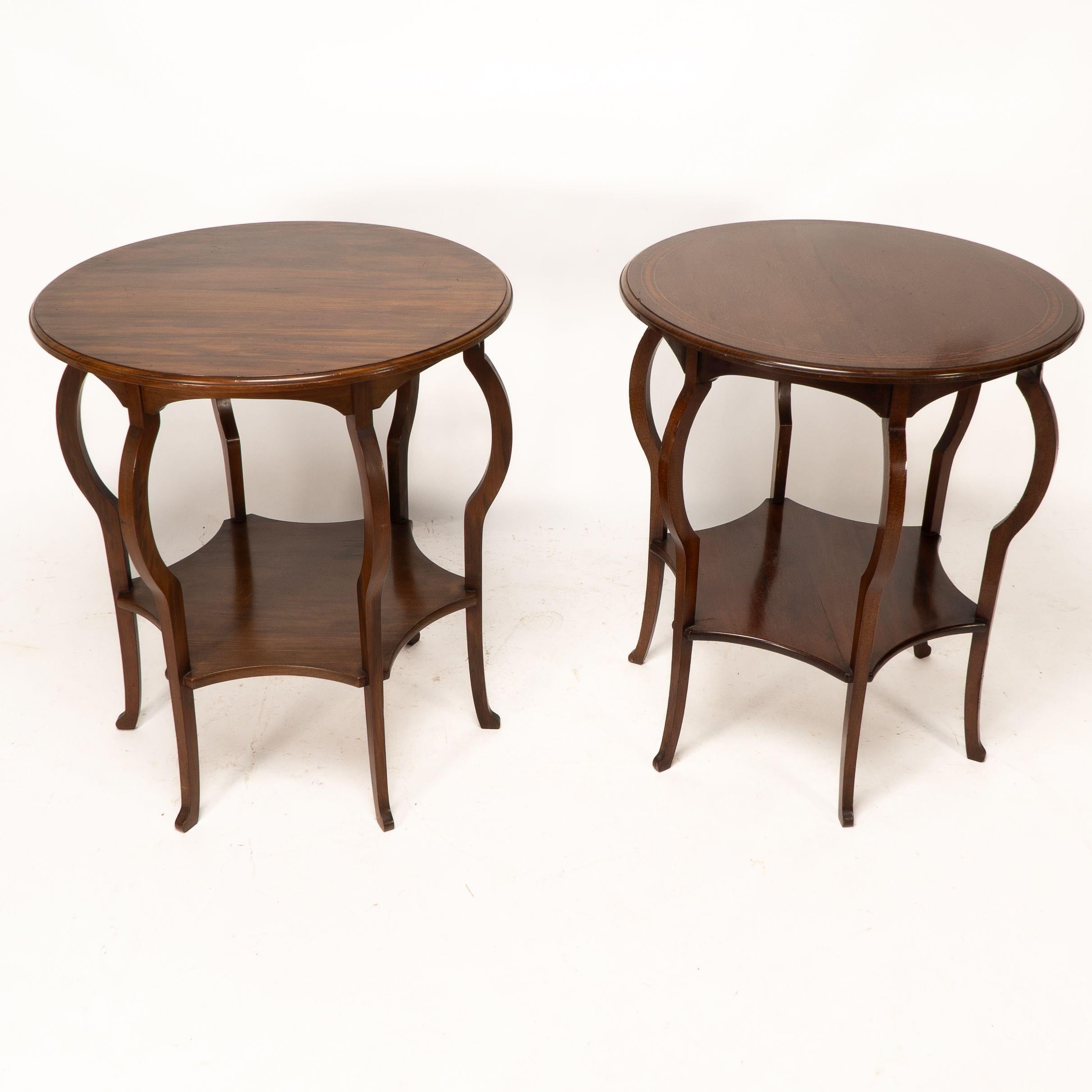 A superb pair of side tables by Marsh Jones and Cribb with circular top and shaped aprons below and fabulous shaped legs united by a shaped lower shelf on little pad feet.