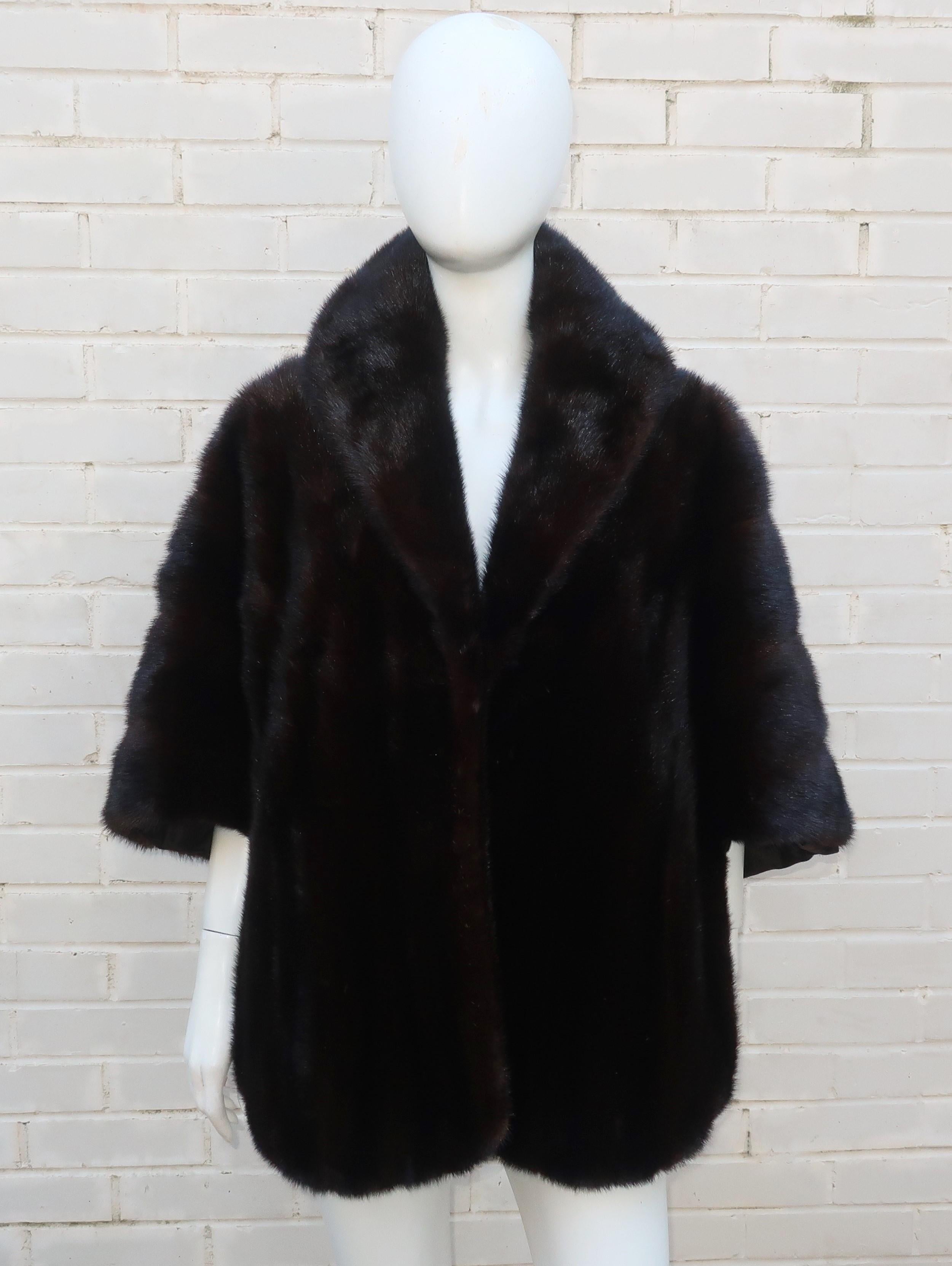 1950's dark brown (near black) mink stole wrap from famed Chicago department store, Marshall Field.  Beautifully made with collar, long front panels, hidden pockets and a long back resembling a cape.  It is lined in dark brown silk taffeta with a