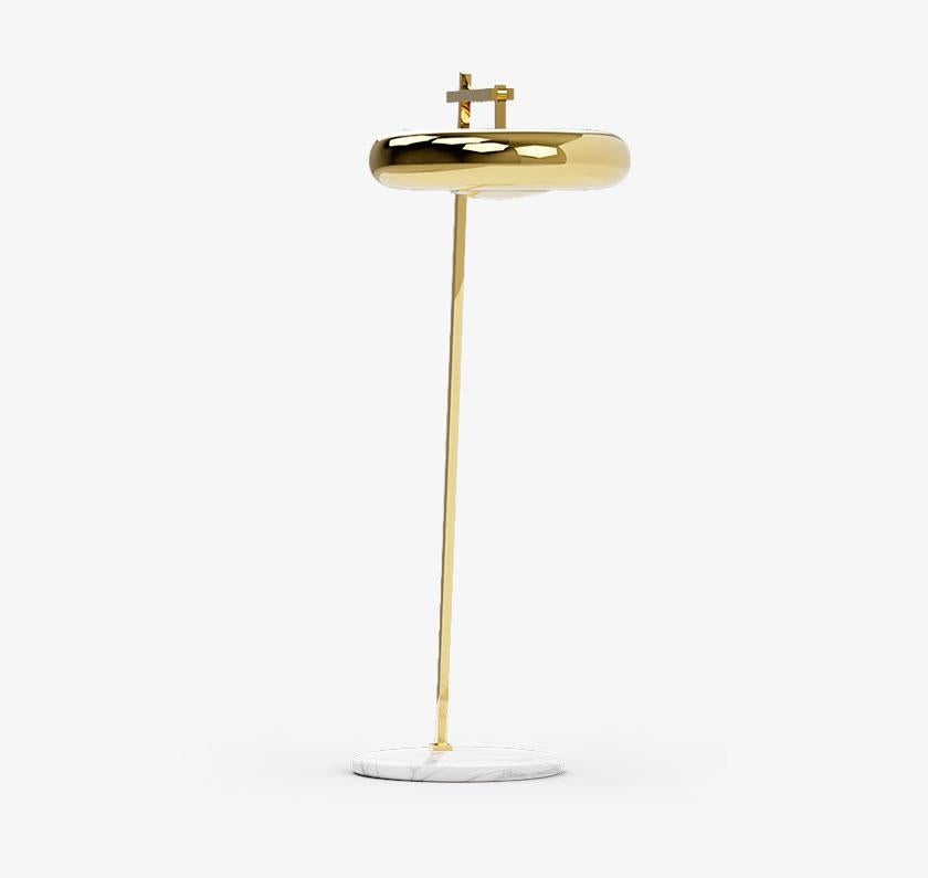 Marshmallow floor lamp, Royal Stranger
Dimensions: 180 x 114 x 65 cm 
Material: Polished brass structure standing on the top of a Carrara marble. (also available in copper or stainless steel in polished or brushed finish.)

A suspending lamp