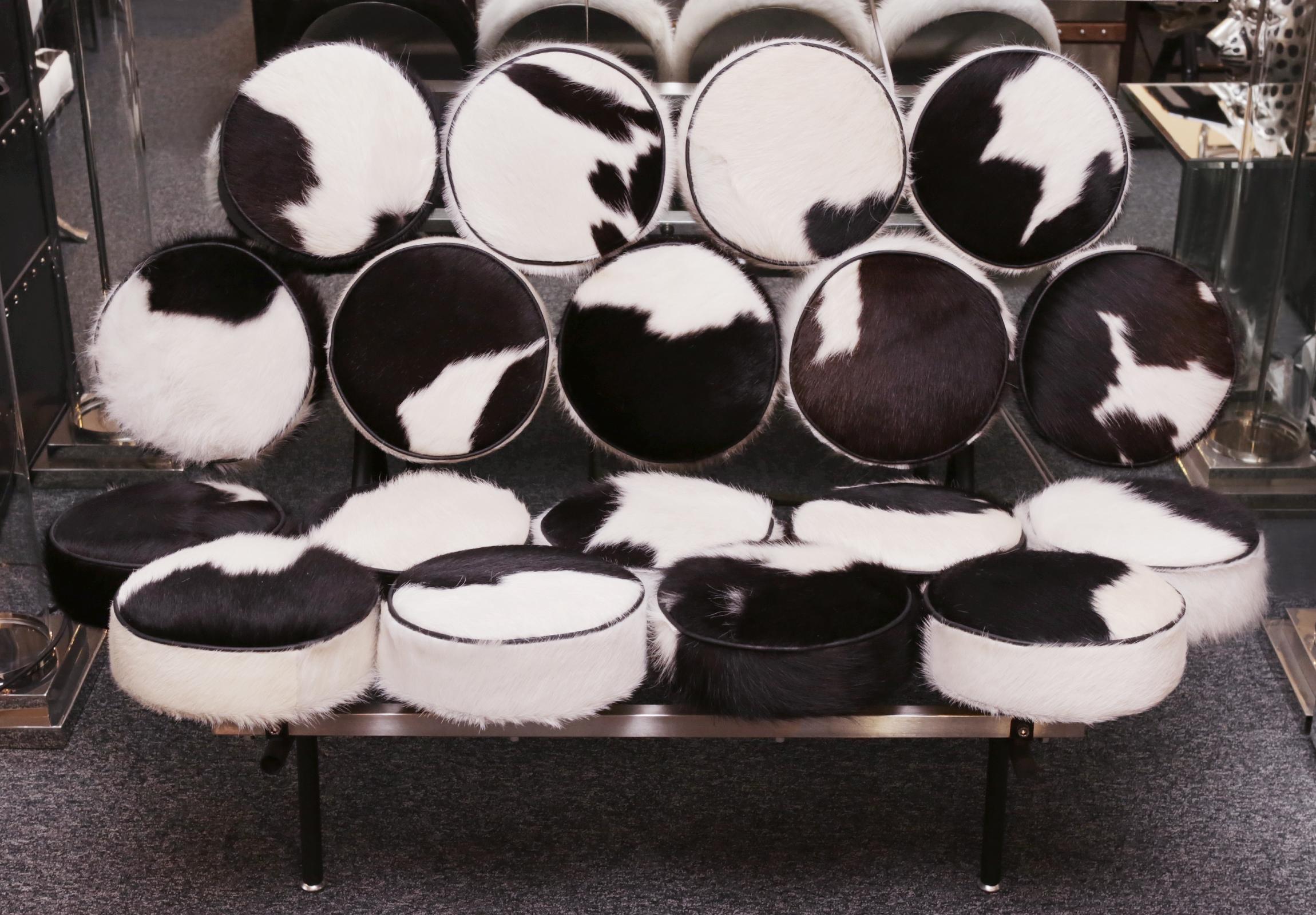 Sofa Marshmallow black and white,
covered with treated natural cowhide,
on polished stainless steel feet.
Exceptional piece.