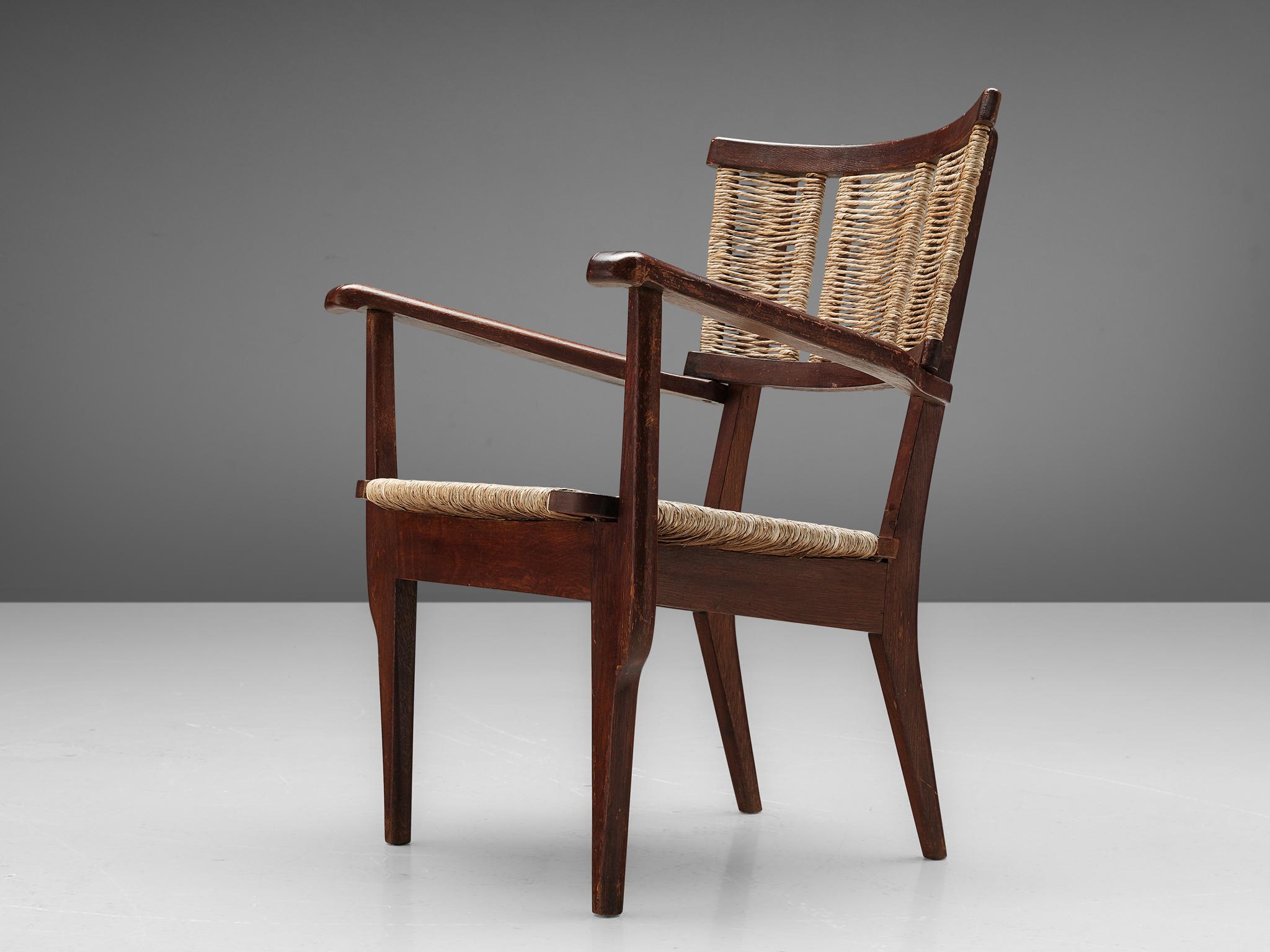 Mart Stam, armchair, oak, straw, The Netherlands, 1947. 

Elegant armchair in solid oak and woven straw. This chair shows the characteristic frame of the influential Dutch designer Mart Stam (1899-1986). The backrest and seat are covered with woven