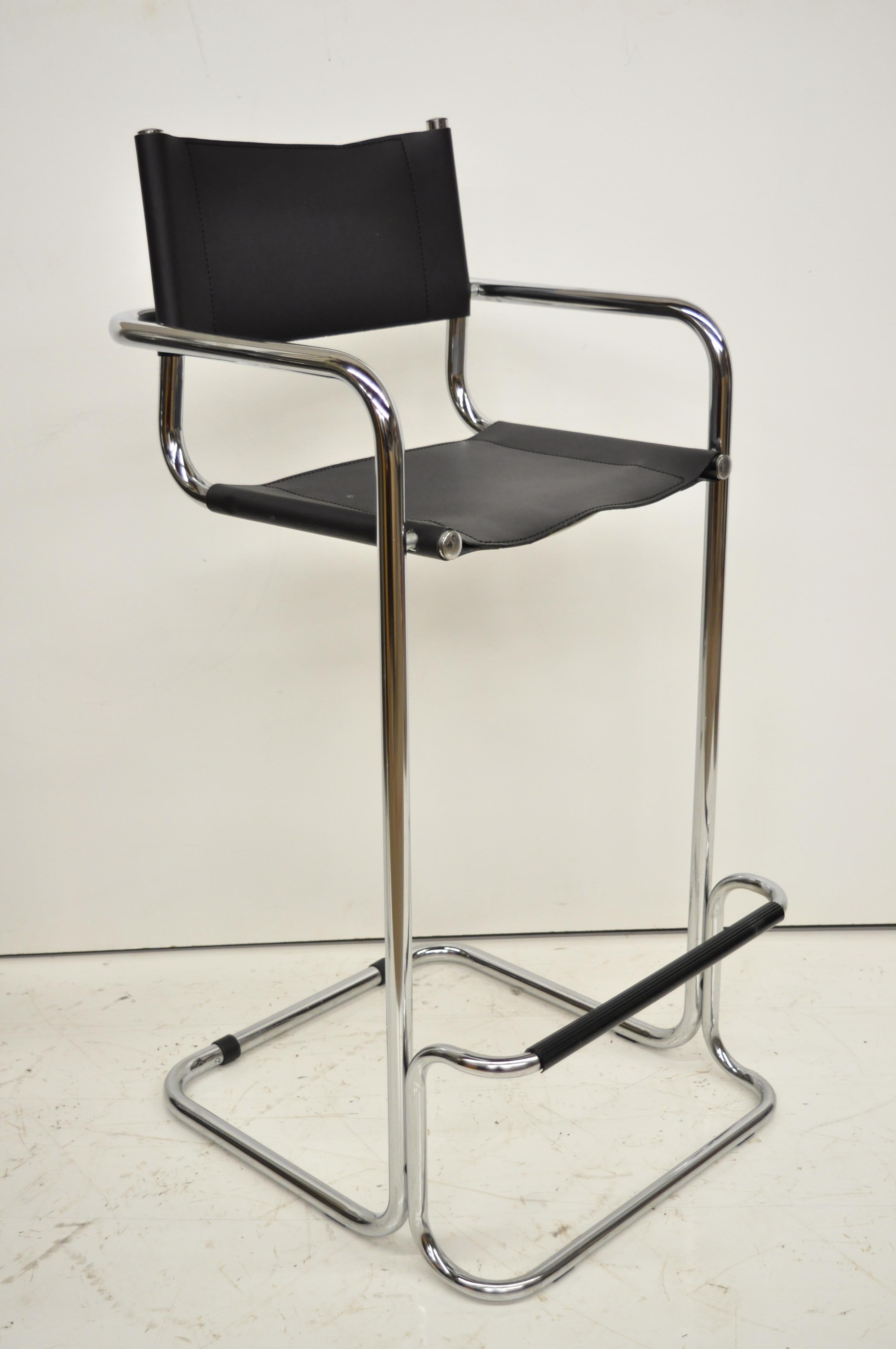 Mart Stam black leather and chrome Italian Mid-Century Modern barstools set of four. Item features chrome metal frames, leather back and seat, and a sleek sculptural form, circa 1970. Measurements: 42