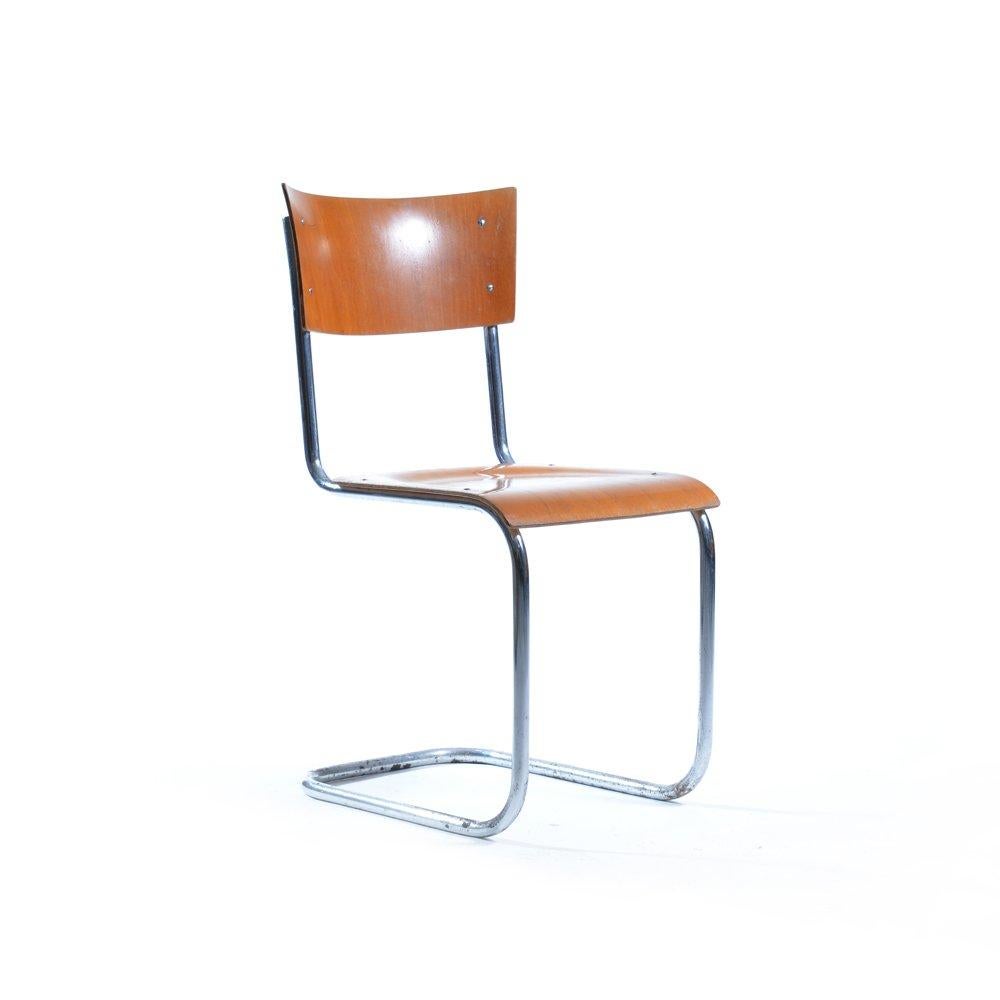 Chair made of bended chrome pipes construction. Bended plywood seat and backrest. Original design by Mart Stam for the Thonet company. In Czechoslovakia the chairs were manufactured by Kovona company. Original condition with small damage on the