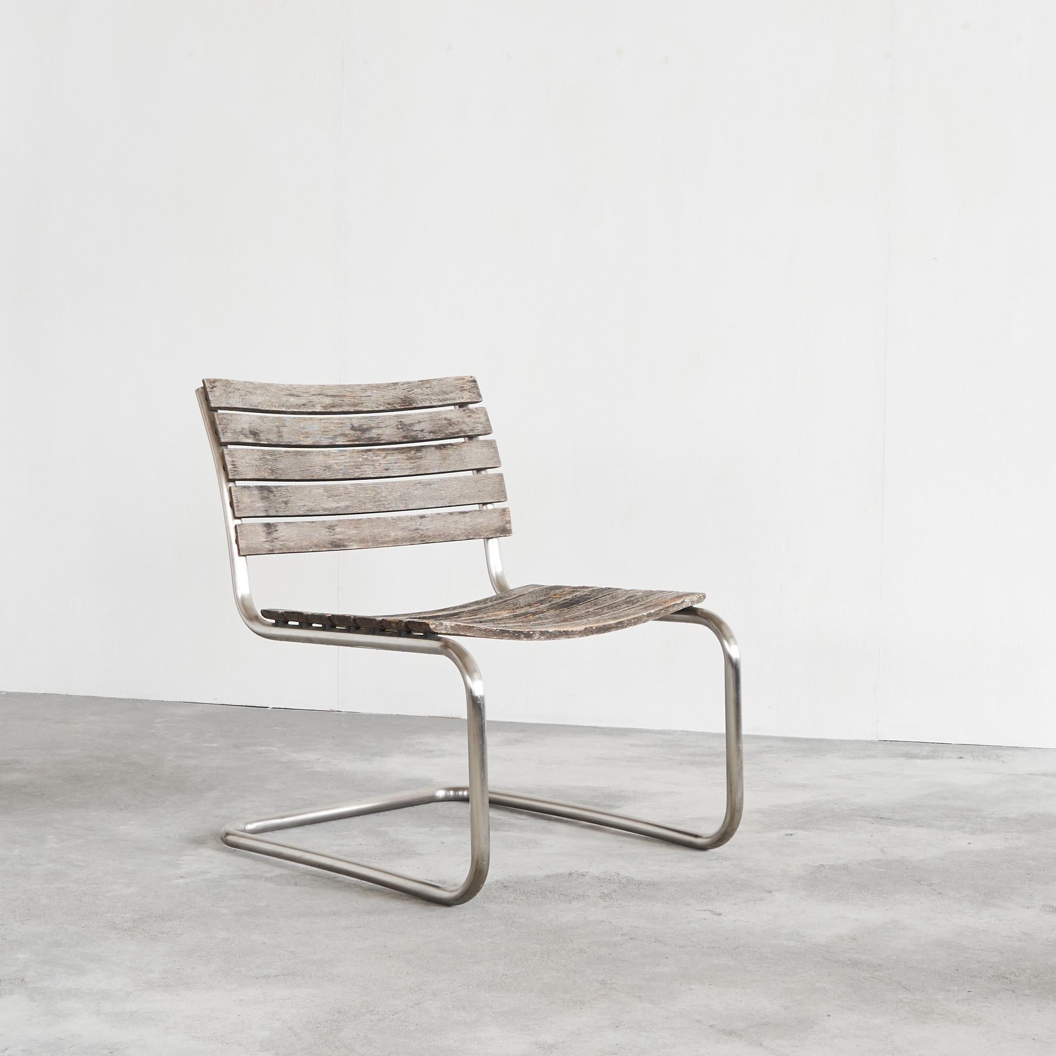 Mart Stam Lounge Chair for Thonet in Weathered Solid Iroko and Stainless Steel, Germany, early 21st century.

Beautiful and rare lounge version of the S40 chair by Mart Stam, which is no longer in production. Early 21st century edition by Thonet in