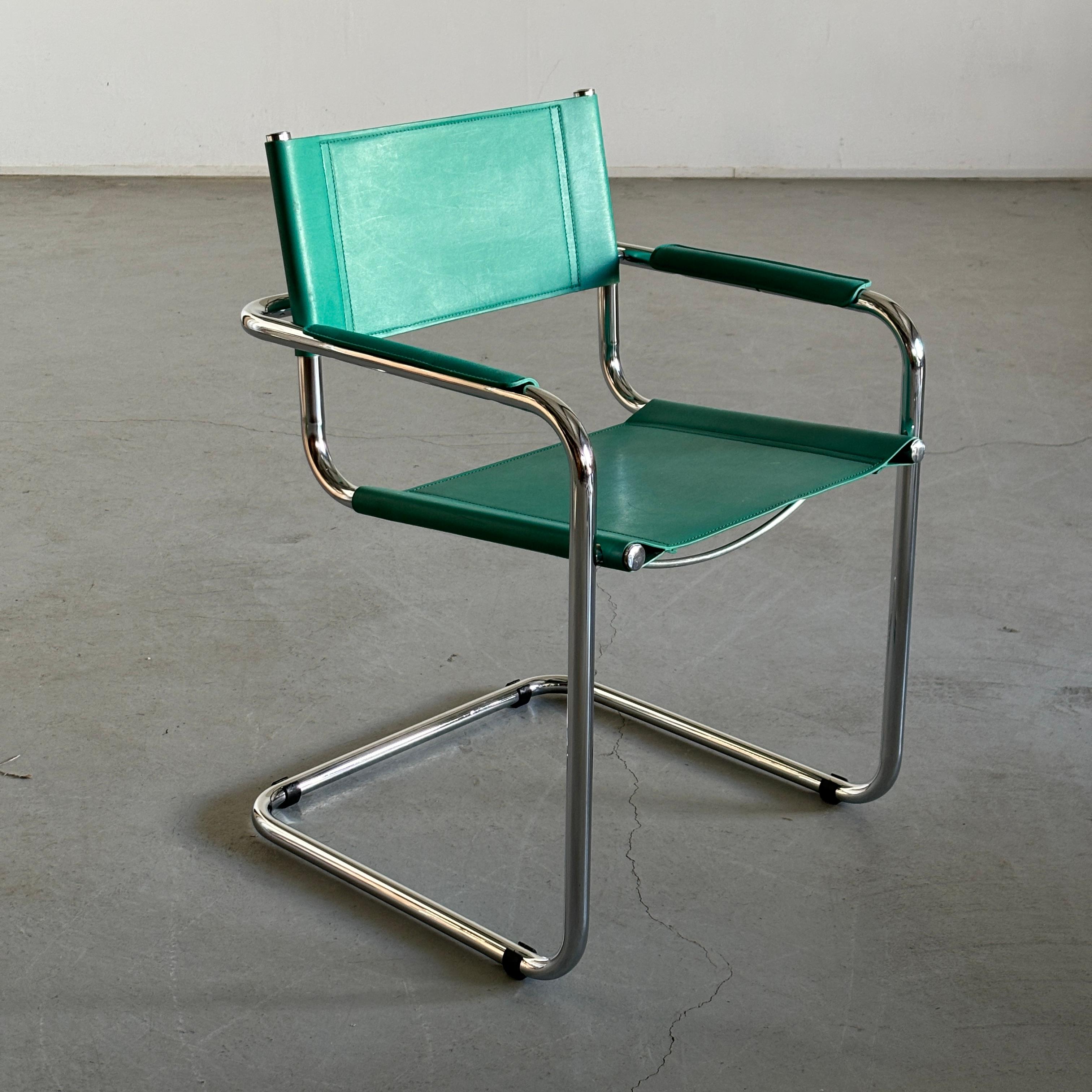 Vintage Mid-century modern cantilever armchairs designed in the Bauhaus style of Mart Stam’s iconic S34. The armchair features a turquoise seat, backrest and armrests with a chromed tubular steel frame.

Manufactured in Italy during the