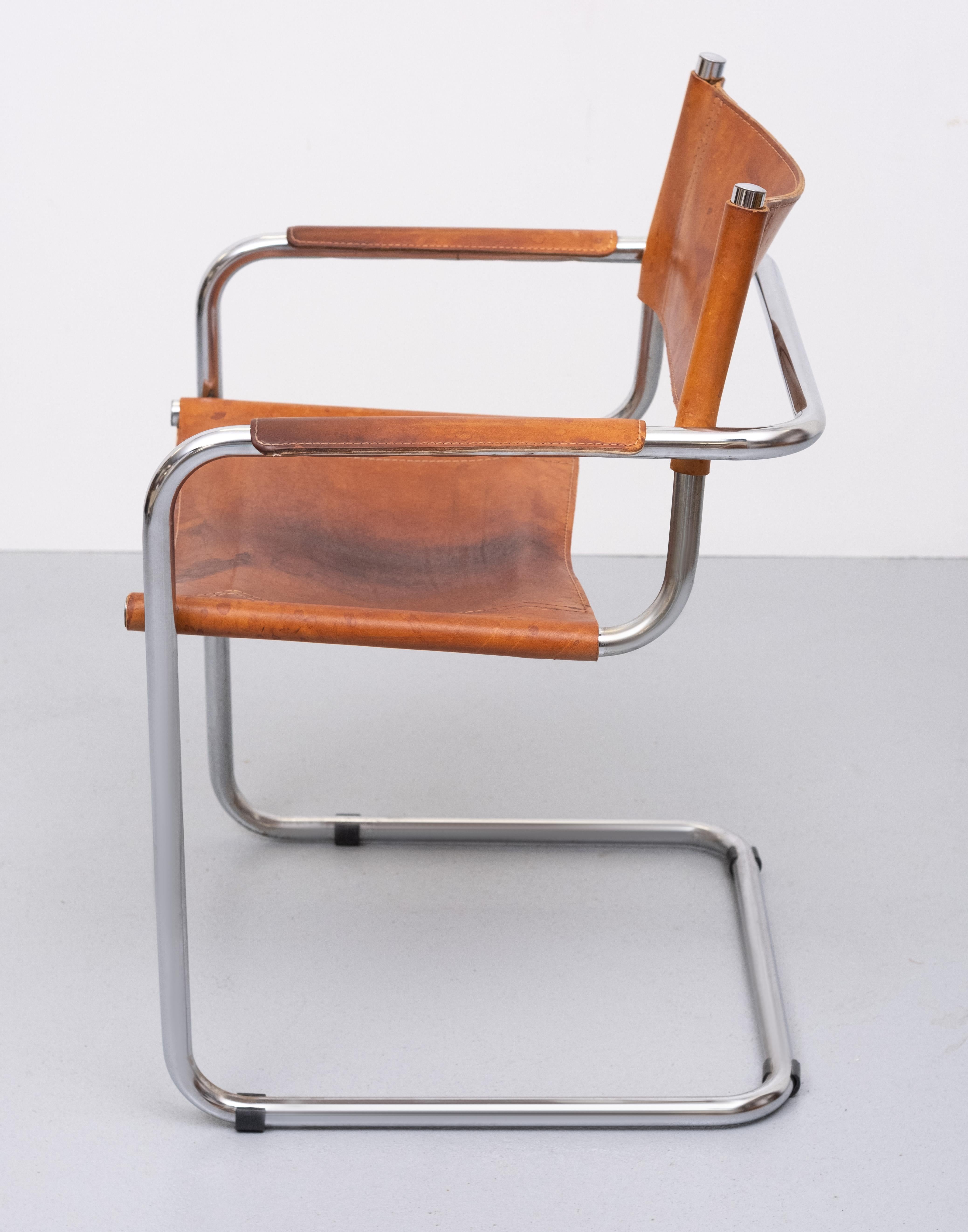 Mart Stam cantilever chair chrome tube frame, comes with a Cognac color saddle Leather. upholstery Iconic chair. Very good seating comfort. love the patina on this chair.
 armrest hight 62 cm.