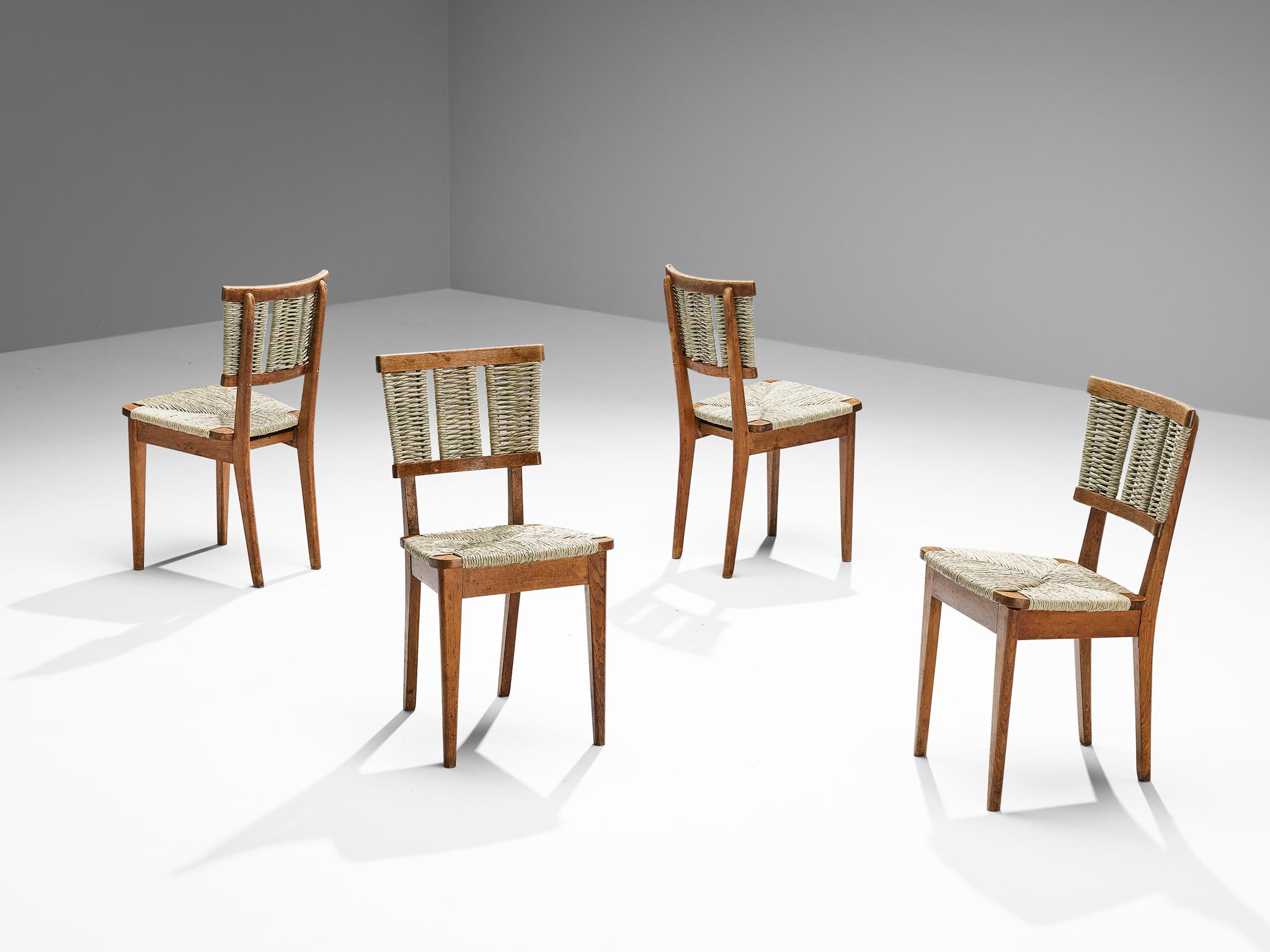 Mart Stam, set of four dining chairs, model 'A2-1', oak, seagrass, The Netherlands, 1947.

Executed in 1947, these dining chairs by Dutch modernist designer and architect Mart Stam (1899-1986) boasts a rustic character. This is achieved by the