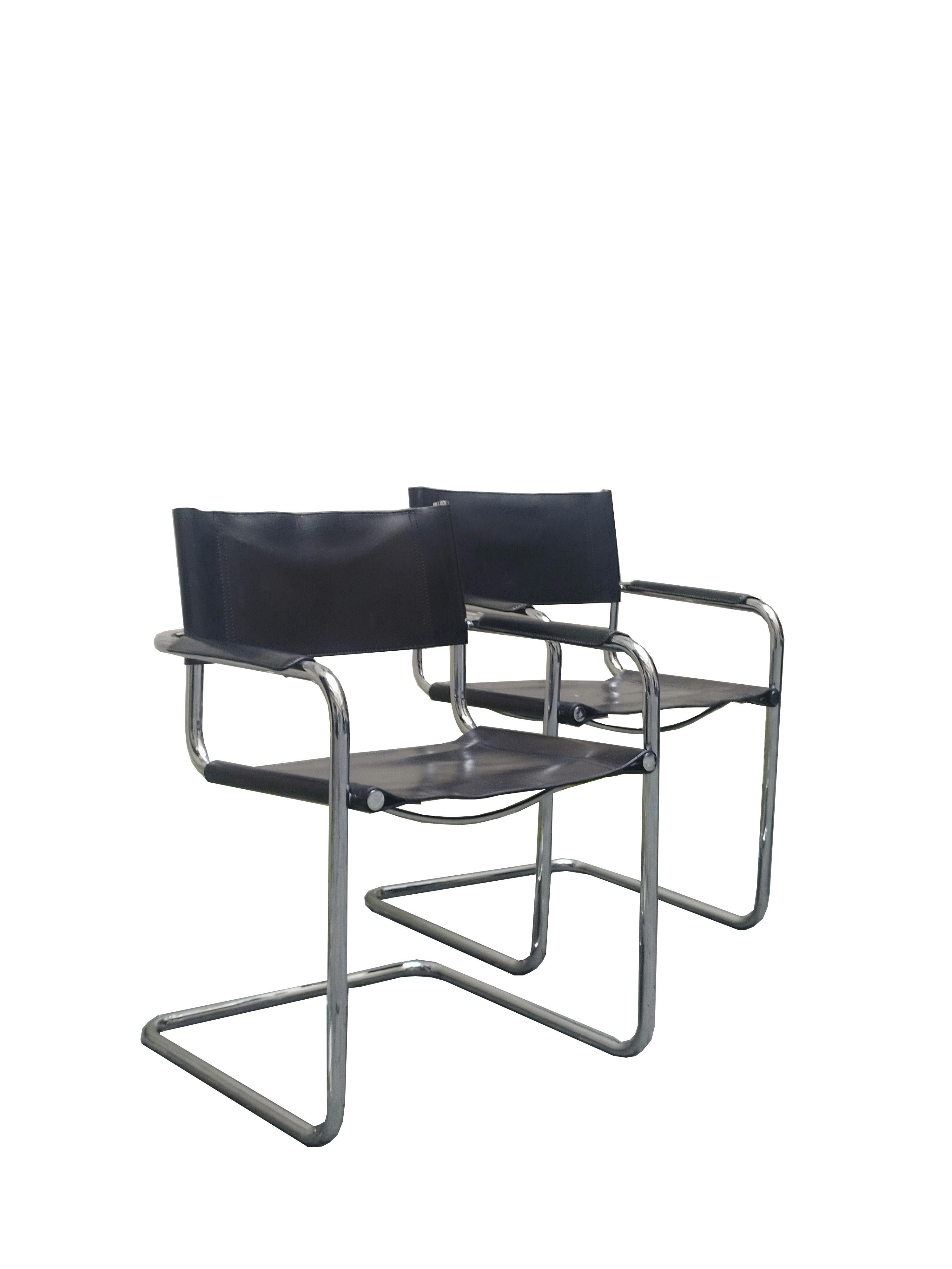 Iconic Bauhaus cantilevered armchairs of chrome tubular steel with black leather sling seat and back and black leather armrests in near pristine condition. Designed by Mart Stam in 1927, chairs of this style were the first cantilevered chairs in