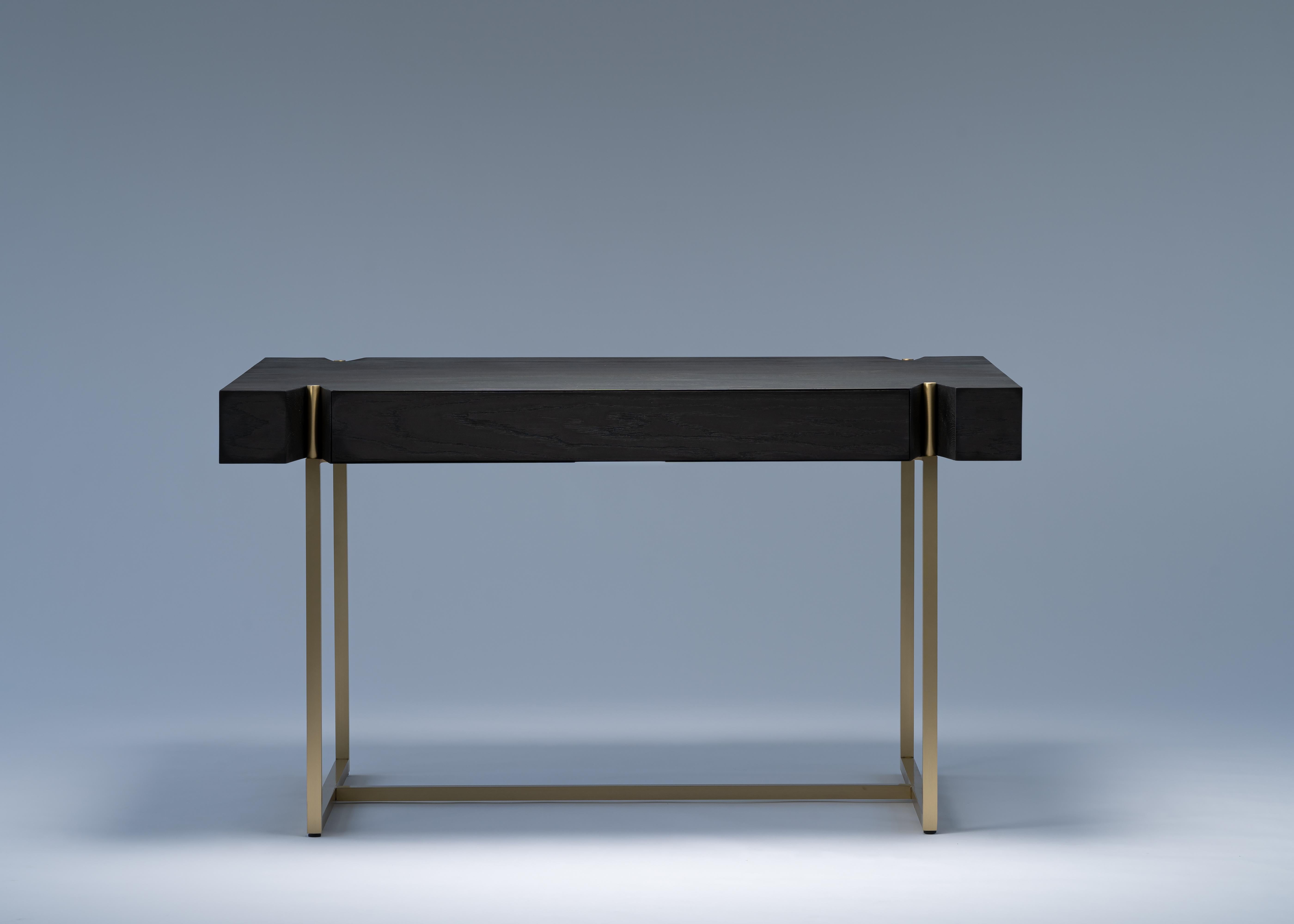 Marta desk by Mandy Graham

Marta
M03, writing desk table with drawer
ebonized sandblasted oak / walnut, brushed brass / dark bronze base
Measures: 54