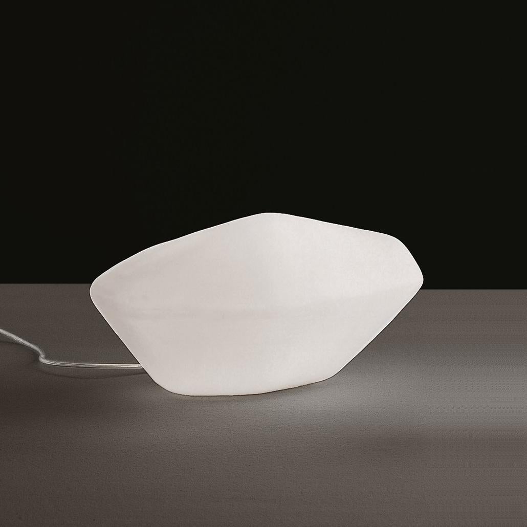 Outdoor lamp 'Stone' designed by Marta Laudani & Marco Romanelli in 2002.
Outside and inside LED lamp, in white polyethylene.
Manufactured by Oluce, Italy.

Direct descendants of the Stone of Glass collection by Laudani & Romanelli, the shapes
