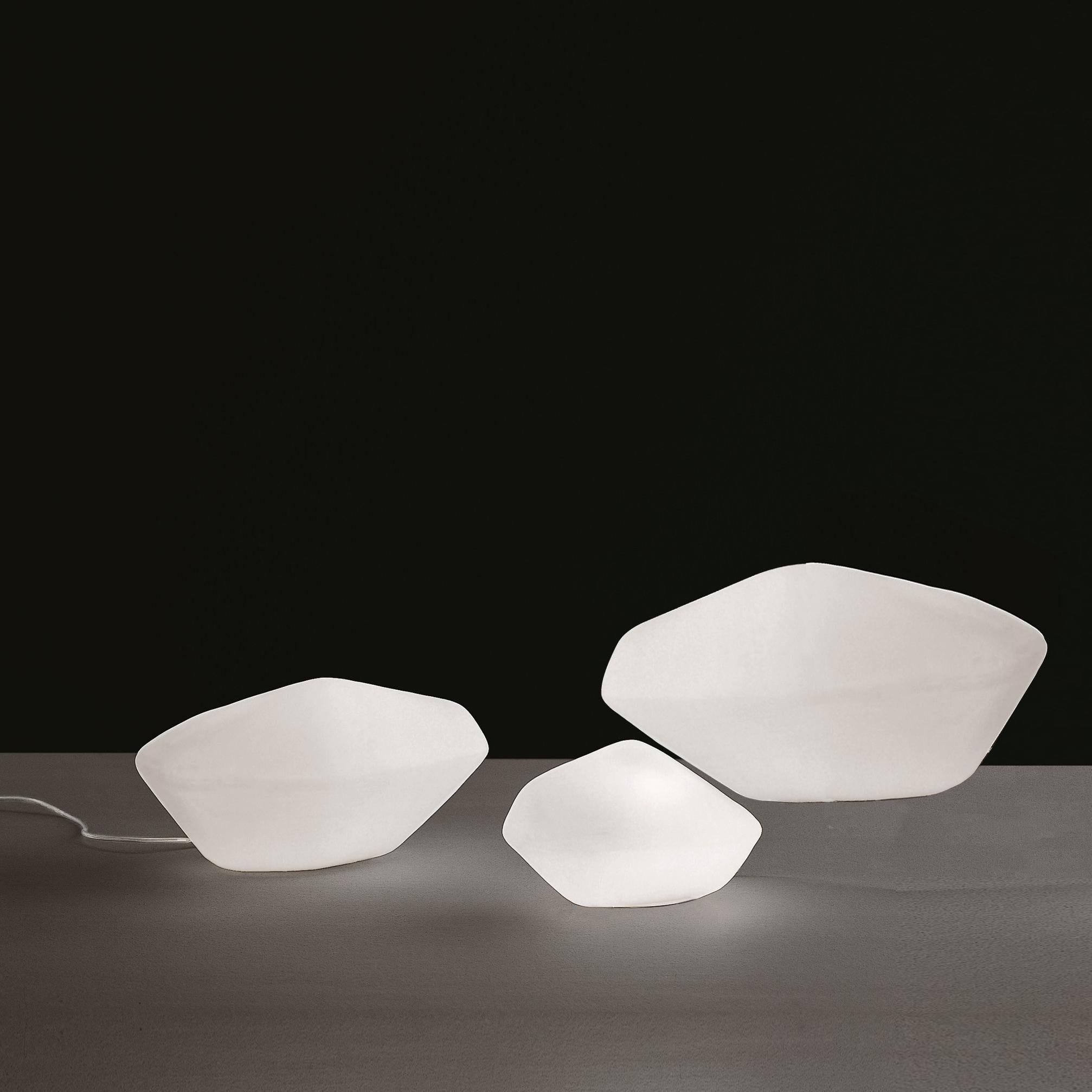 Set of three outdoor lamps 'Stone' designed by Marta Laudani & Marco Romanelli in 2002.
Outside and inside LED lamp, in white polyethylene.
Manufactured by Oluce, Italy.

Direct descendants of the Stone of Glass collection by Laudani &