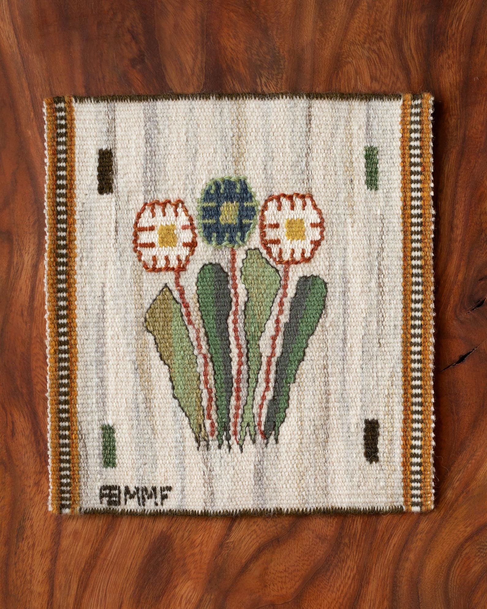 Handwoven tapestry with daisies, designed by Märta Måås-Fjetterström in 1939. 

Woven in wool on a wool warp and at the Märta Måås-Fjetterström studio in Båstad, Sweden. 

The tapestry can be framed, mounted as a decorative pillow, or used on a