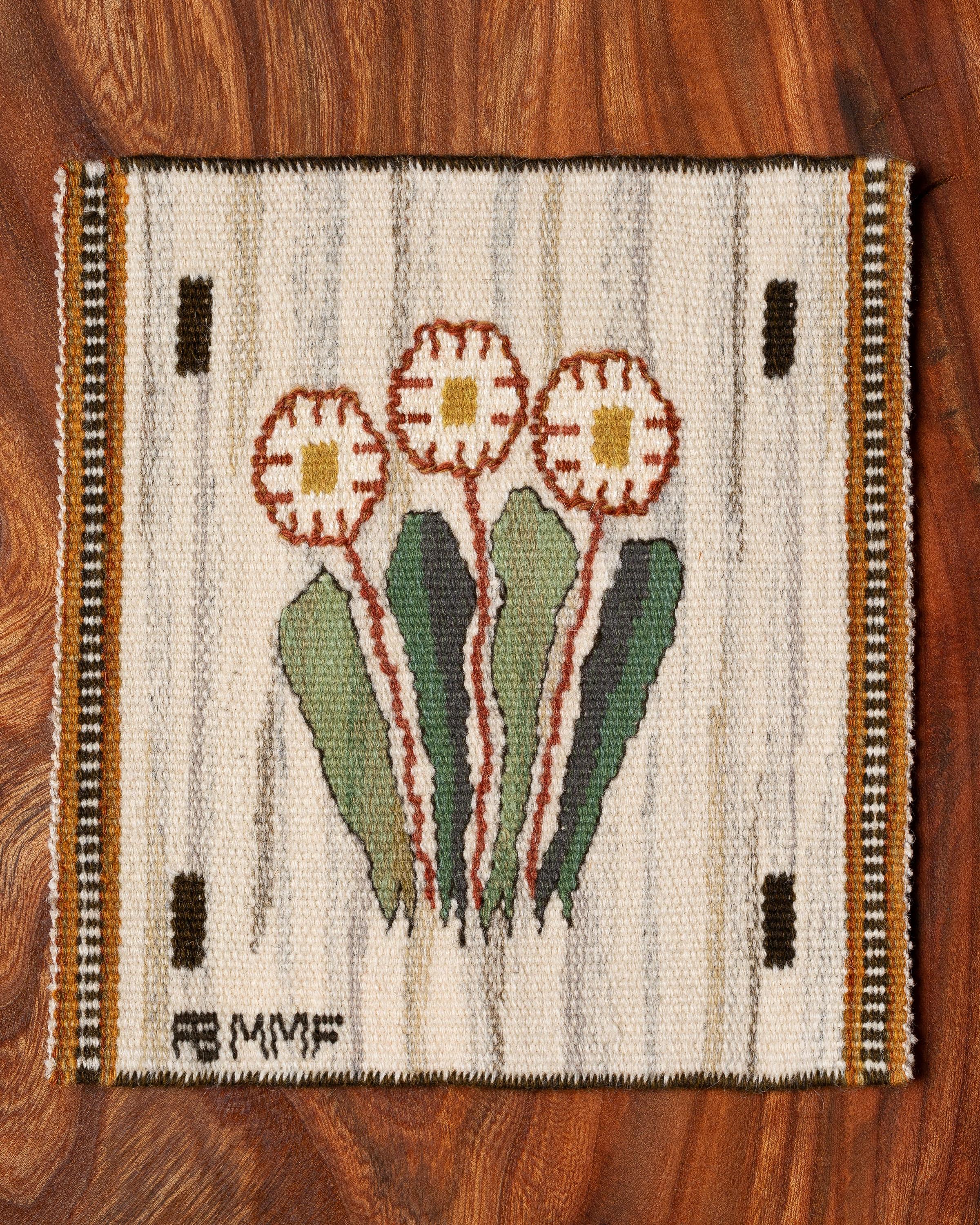 Handwoven tapestry with daisies, designed by Märta Måås-Fjetterström in 1939. 

Woven in wool on a wool warp and at the Märta Måås-Fjetterström studio in Båstad, Sweden. 

The tapestry can be framed, mounted as a decorative pillow, or used on a