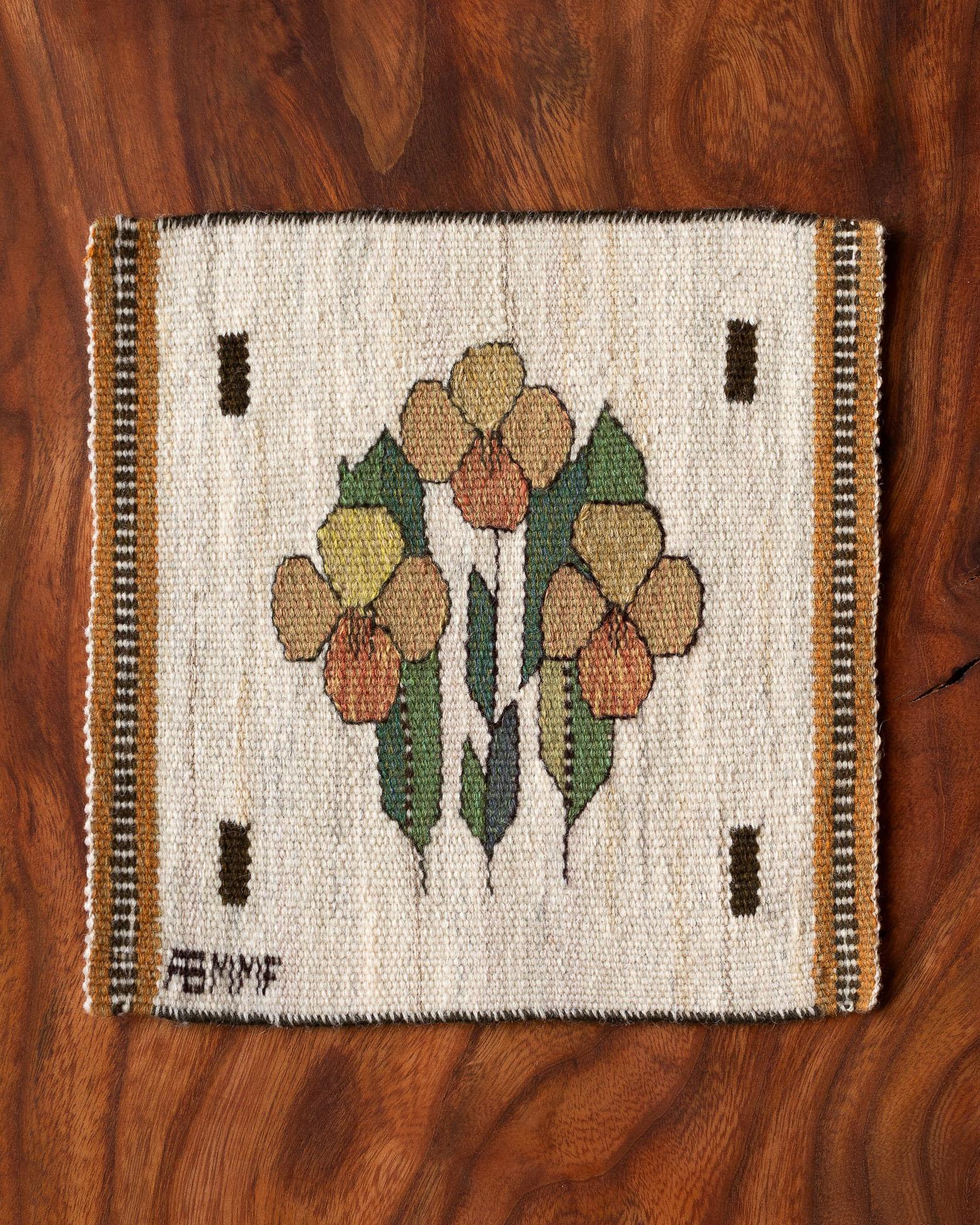 Handwoven tapestry with pansies, designed by Märta Måås-Fjetterström in 1939. 

Woven in wool on a wool warp and at the Märta Måås-Fjetterström studio in Båstad, Sweden. 

The tapestry can be framed, mounted as a decorative pillow, or used on a