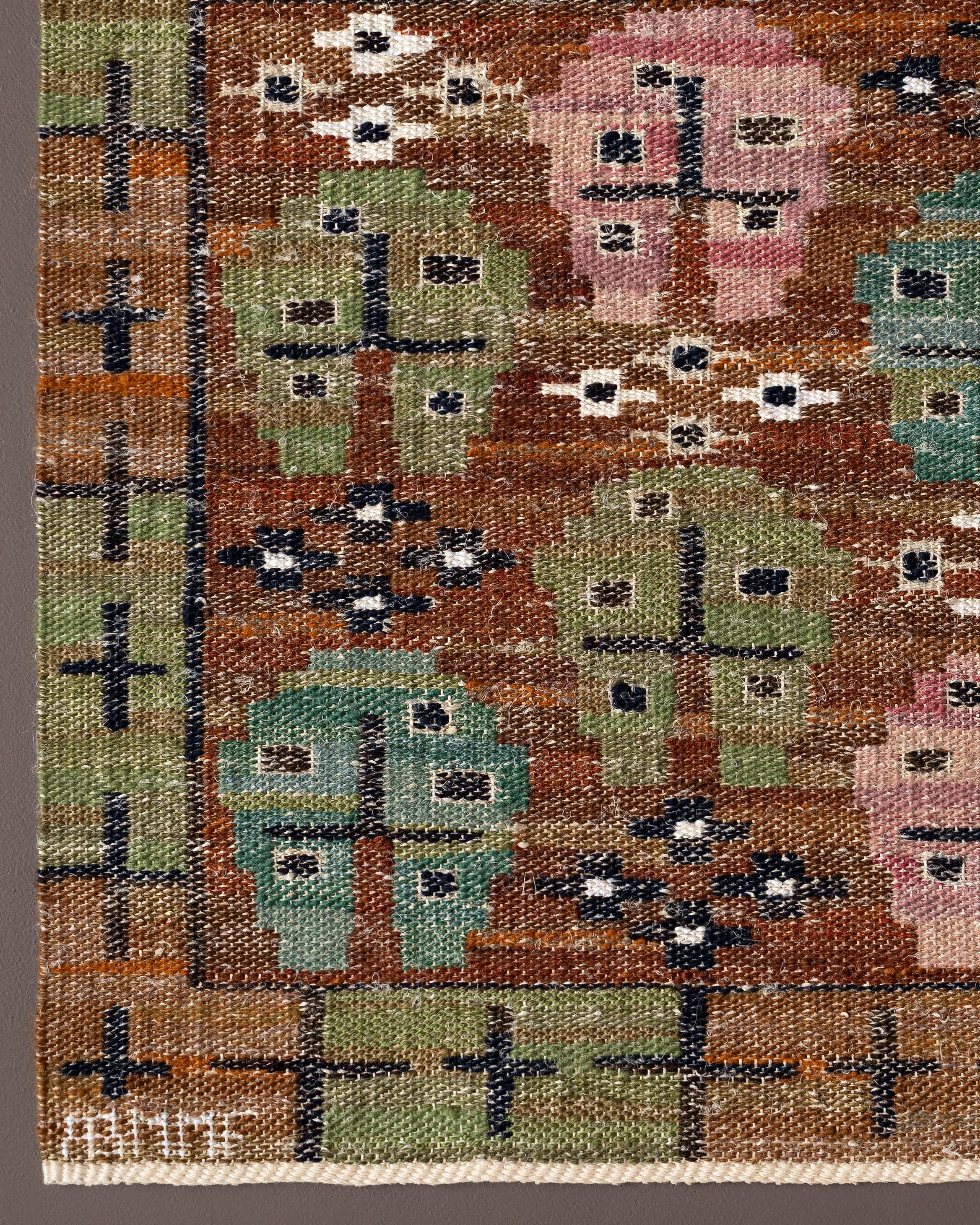 Handwoven tapestry with floral motif, designed by Märta Måås-Fjetterström in 1932. 

Woven in wool and hand spun linen on a linen warp by artisan weaver Petra Elström in 2012 at the Märta Måås-Fjetterström studio in Båstad, Sweden. 

The tapestry