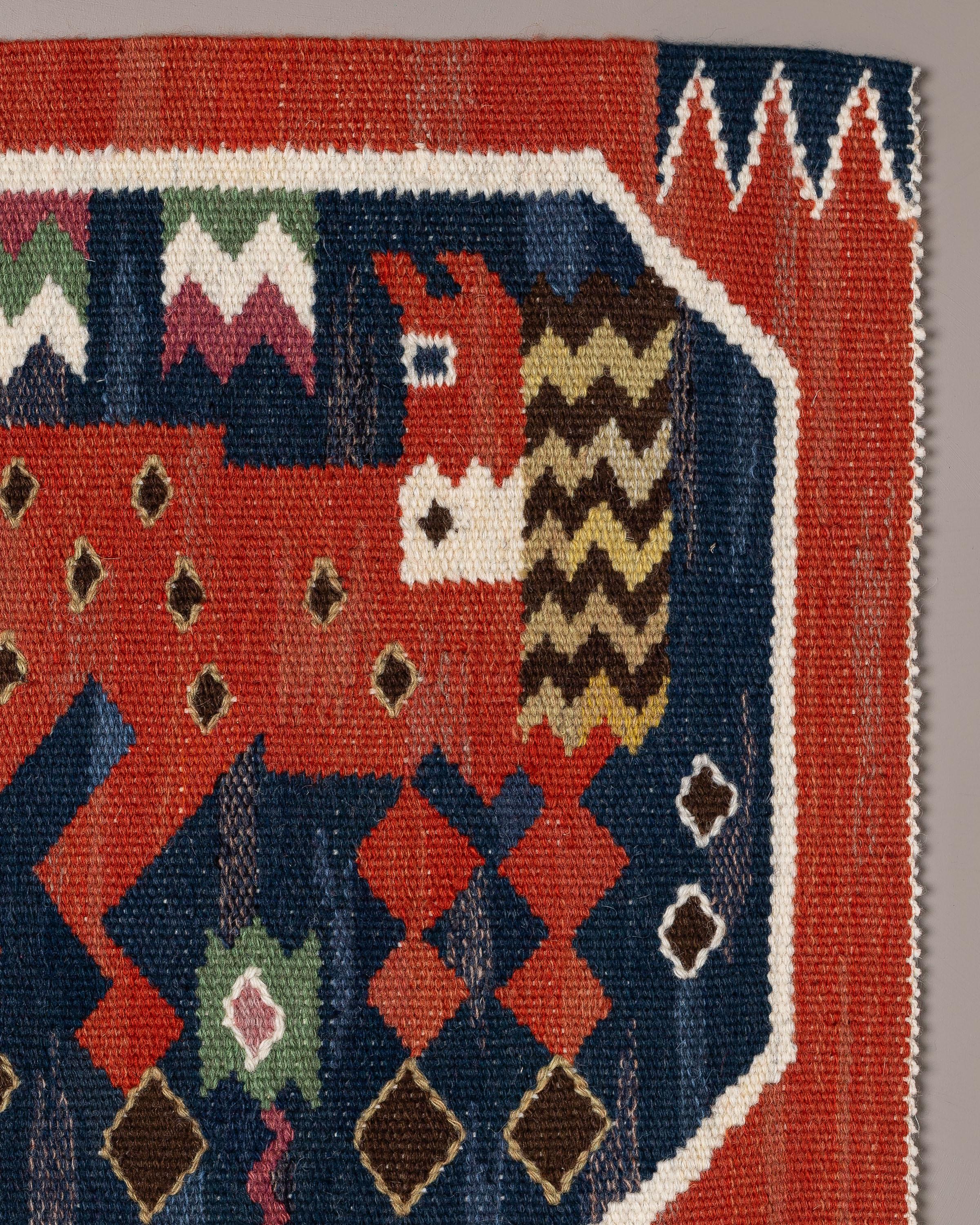 
Handwoven tapestry in wool with motif of a red horse, designed by Märta Måås-Fjetterström in 1930. 

Several horses with different poses appears in the collection of red horses by MMF. They are details from the large wall tapestry Röda Hästarna,
