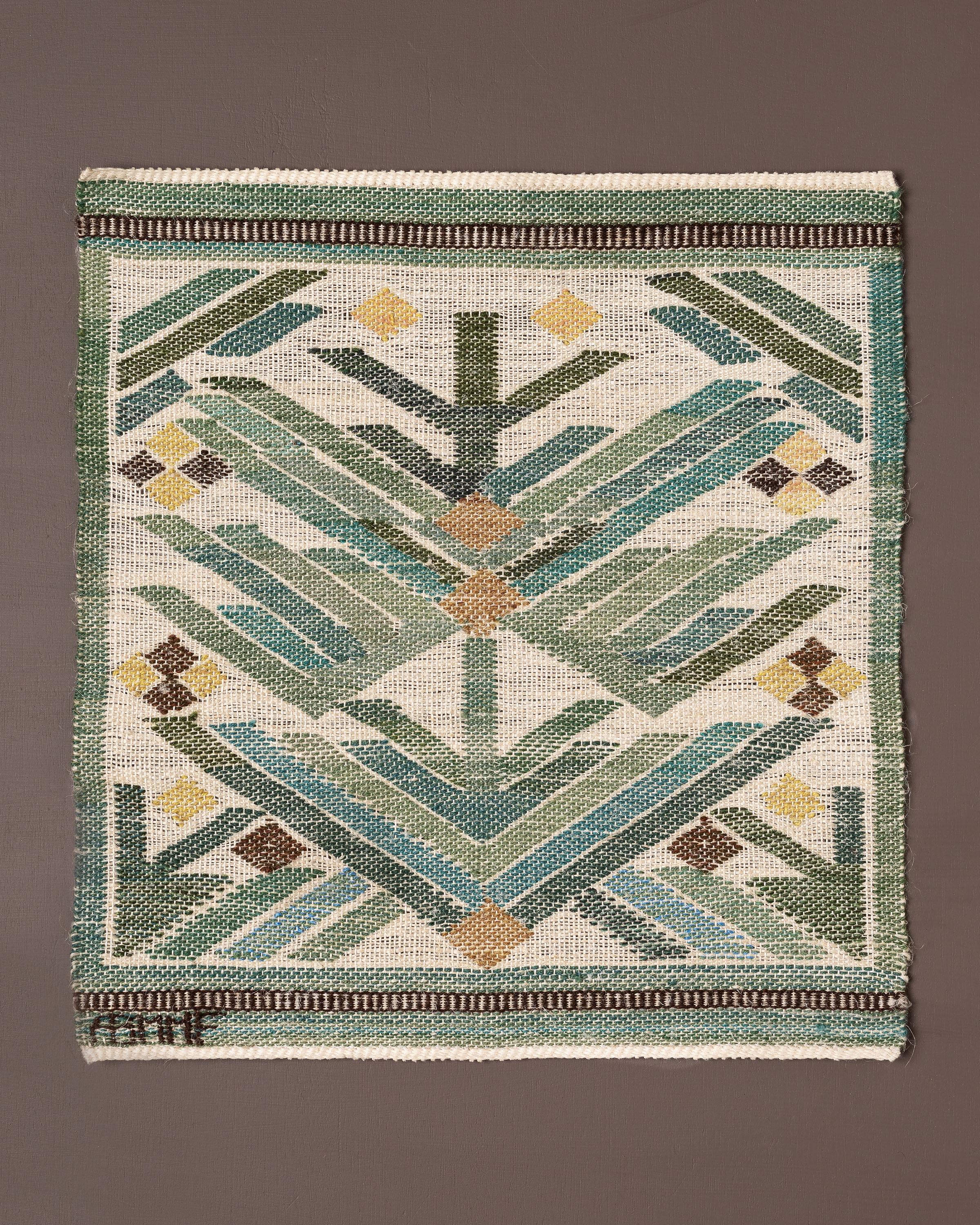 Handwoven tapestry depicting pine branch, designed by Märta Måås-Fjetterström. 

Woven in wool and linen on a linen warp and at the Märta Måås-Fjetterström studio in Båstad, Sweden. 

The tapestry can be framed, mounted as a decorative pillow, or