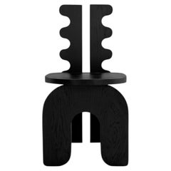 Sedia Marte, realizzata a mano in legno massello con design scultoreo, prodotta in Messico