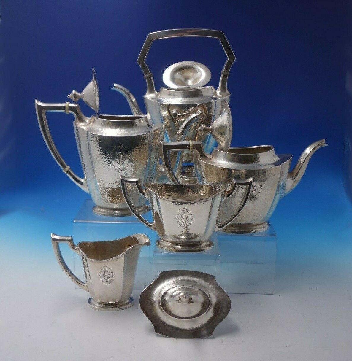 Martel by International

Remarkable Martel by International sterling silver 5-piece tea set. This set includes:

1 - Kettle on Stand: Marked #306H1, holds 2 1/2 pints, measures 13