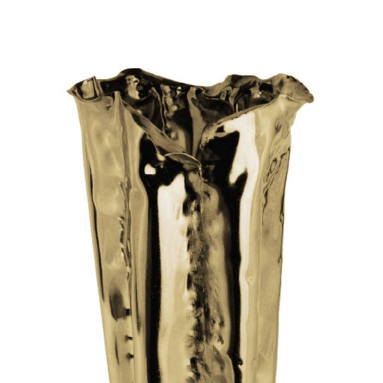 The Martellato Tall Vase is a sculptural object of refined presence, created entirely by hand through a slow, intentional process that highlights the artistry behind every detail. Its hammered brass texture, rich in rhythm and depth, introduces a