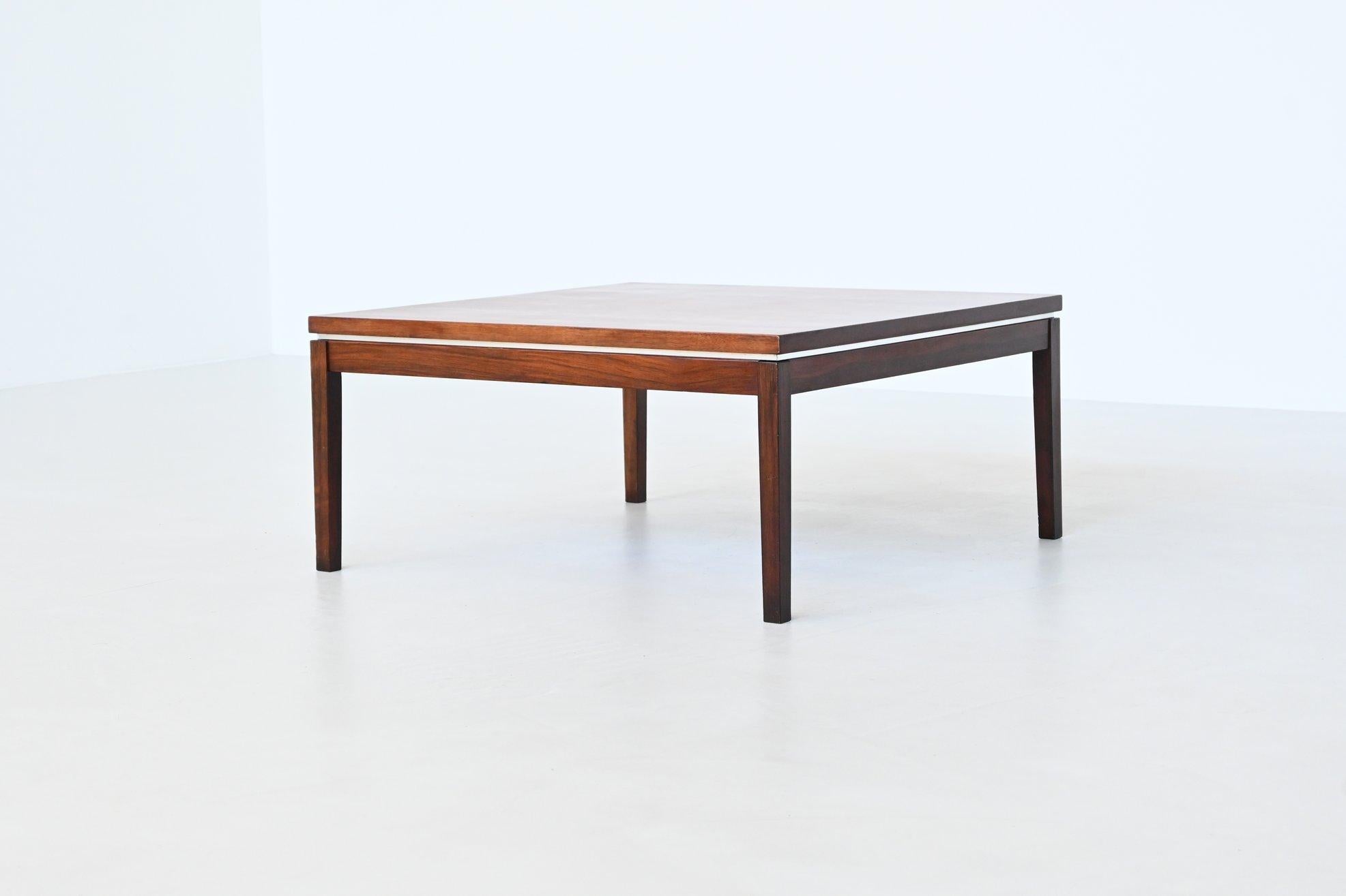 Very nice square shaped coffee table model XKT designed by Martin Franckena for Fristho Franeker, The Netherlands 1960. The top is made of beautiful grained veneered rosewood supported by a frame with four solid rosewood slender legs. Between the