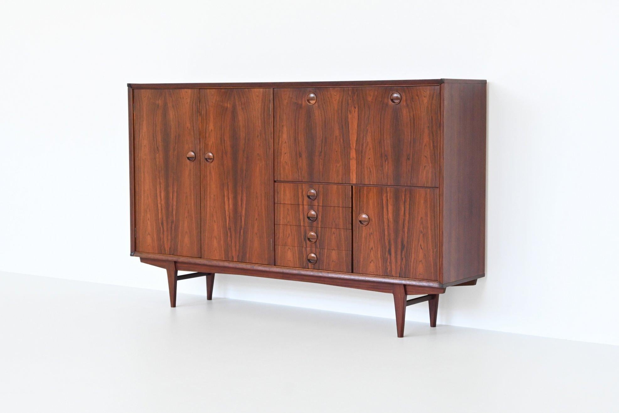 Beautiful highboard model PSR-130 designed by Marten Franckena and manufactured by Fristho Franeker, The Netherlands 1962. This superb refined highboard is made of rosewood with a beautiful grain structure. It features wonderful details and great