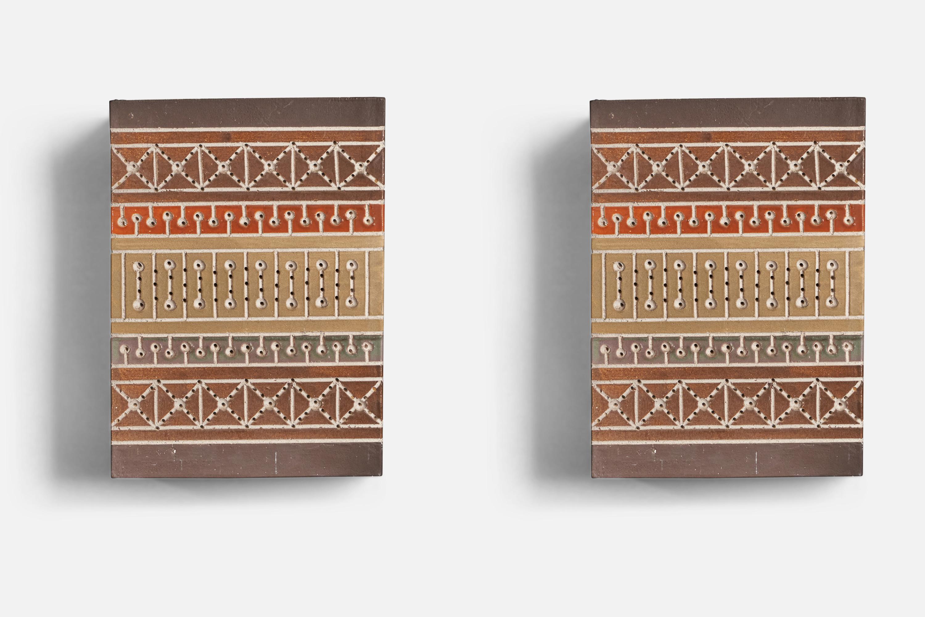 A pair of sizeable hand-painted ceramic wall lights or sconce covers designed and produced by Martha and Beaumont Mood, San Antonio, Texas, USA, 1970s. 

Overall Dimensions (inches): 15.25