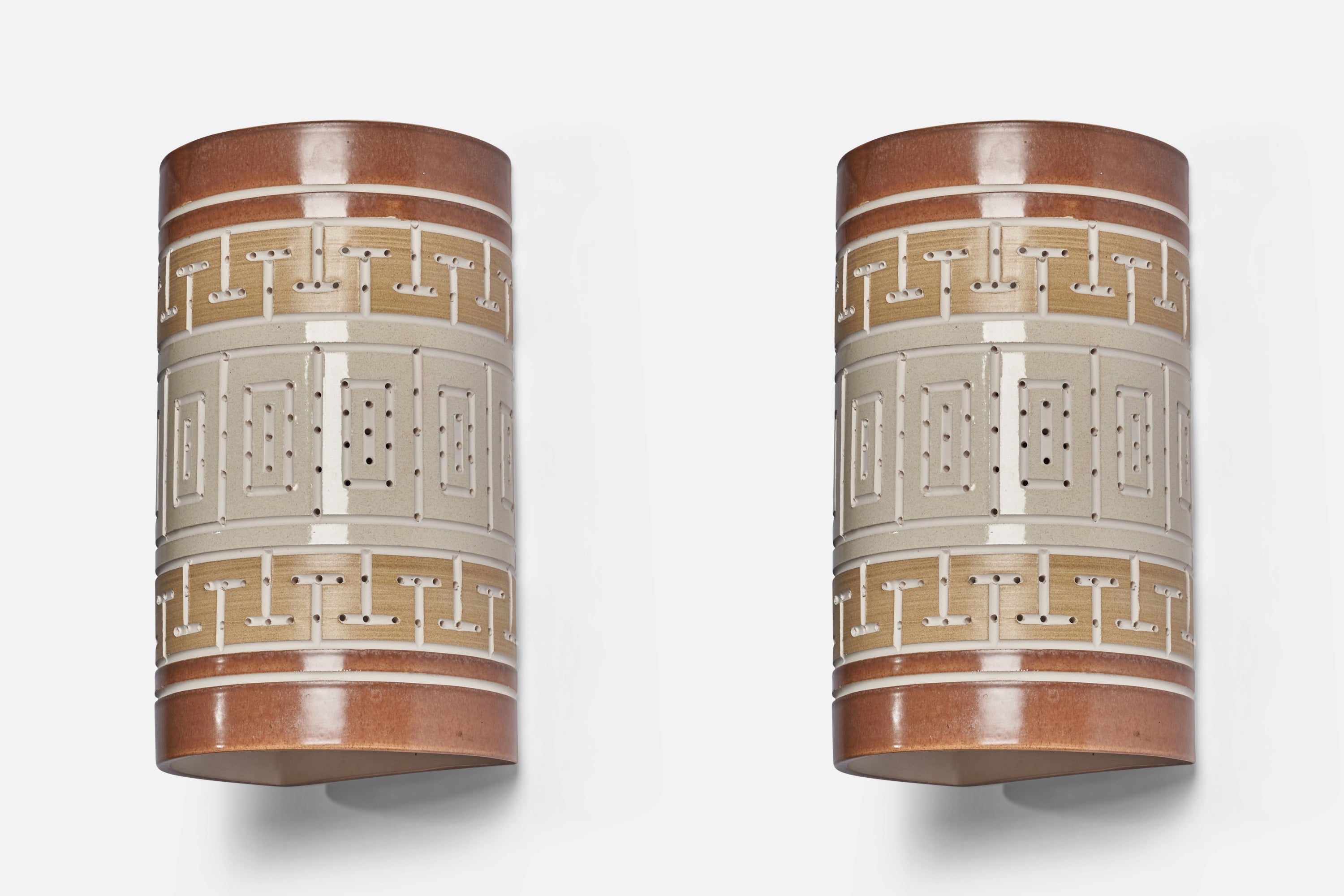 A pair of hand-painted brown, beige and grey ceramic wall lights designed and produced by Martha and Beaumont Mood, San Antonio, Texas, USA, 1970s.

Overall Dimensions (inches): 12.4