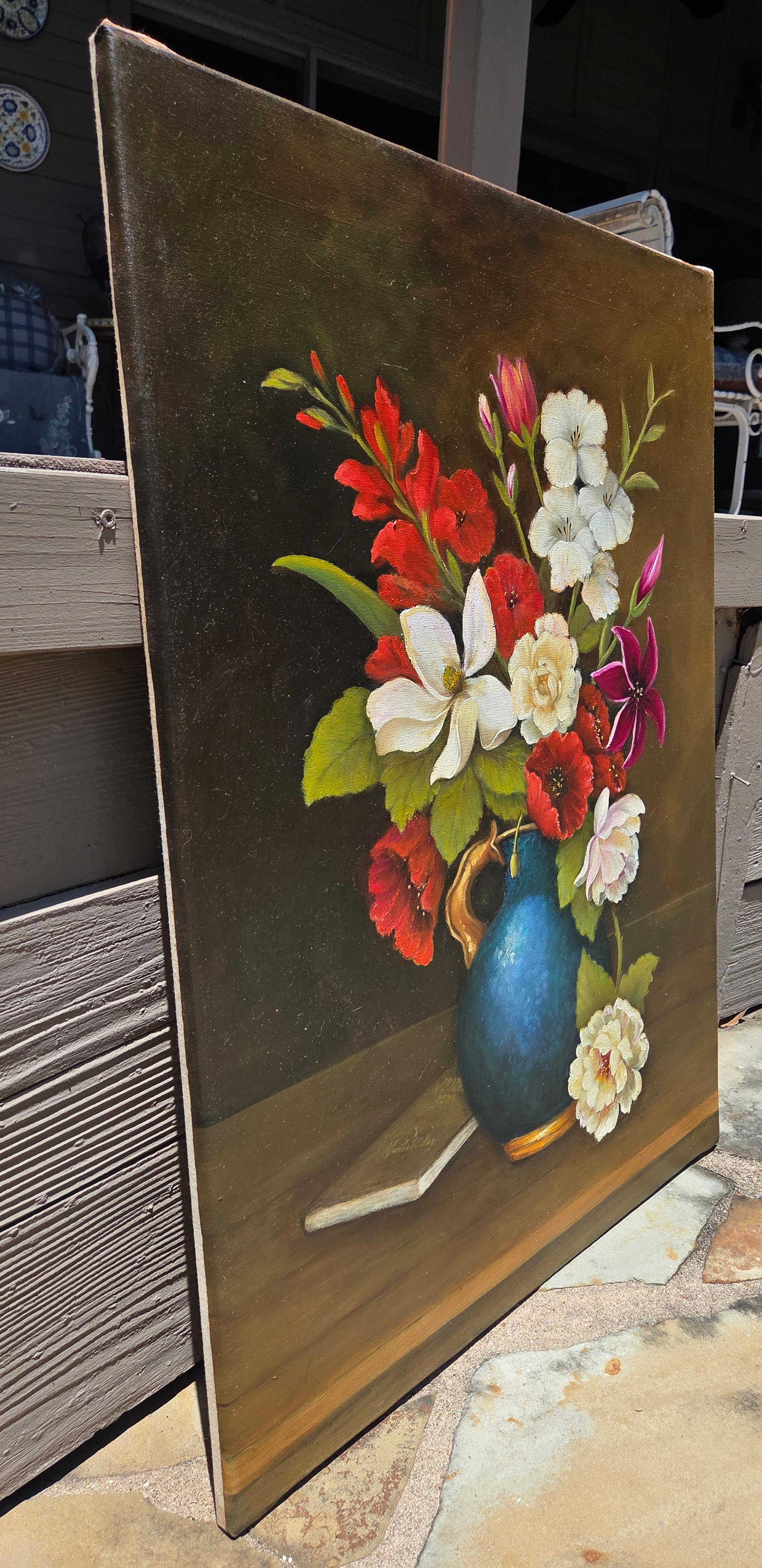 Oil on Canvas
32 x 24 inches
Unframed

 A sumptuous, Baroque style still life featuring a blue vase of delicate white and pink  and red flowers surrounded in fresh green foliage.  The types of flowers include white and magenta lilies, white roses,