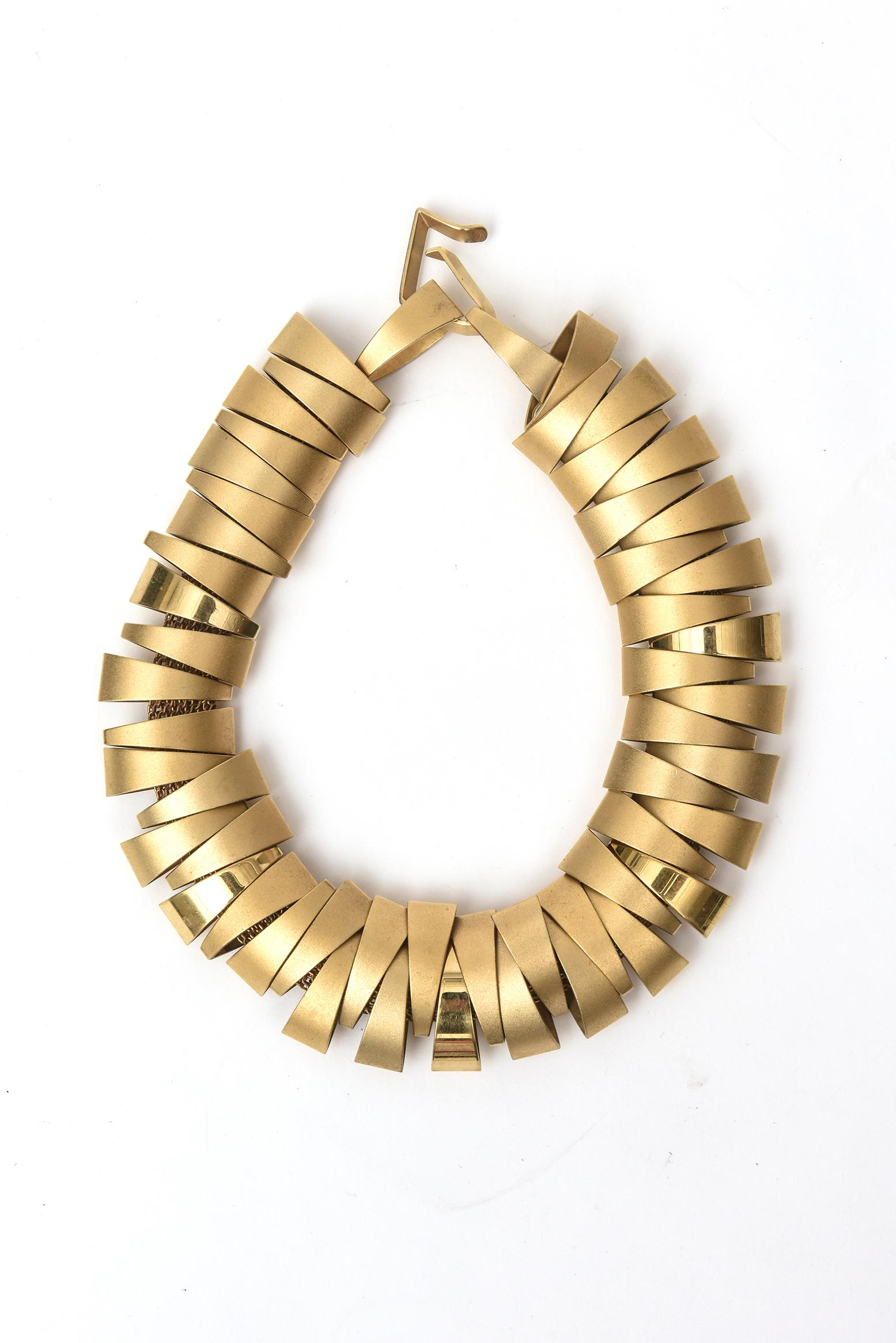 This amazing and stunning sculptural gold plated collar necklace belonged to an important collector. It is not signed. We do not know who designed the piece but it is fabulous. This needs a very small long neck and is a conversation piece of