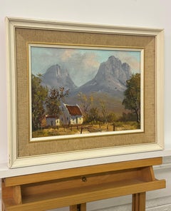 Peinture à l'huile ancienne d'un chalet remote dans les montagnes dramatiques d'Afrique du Sud