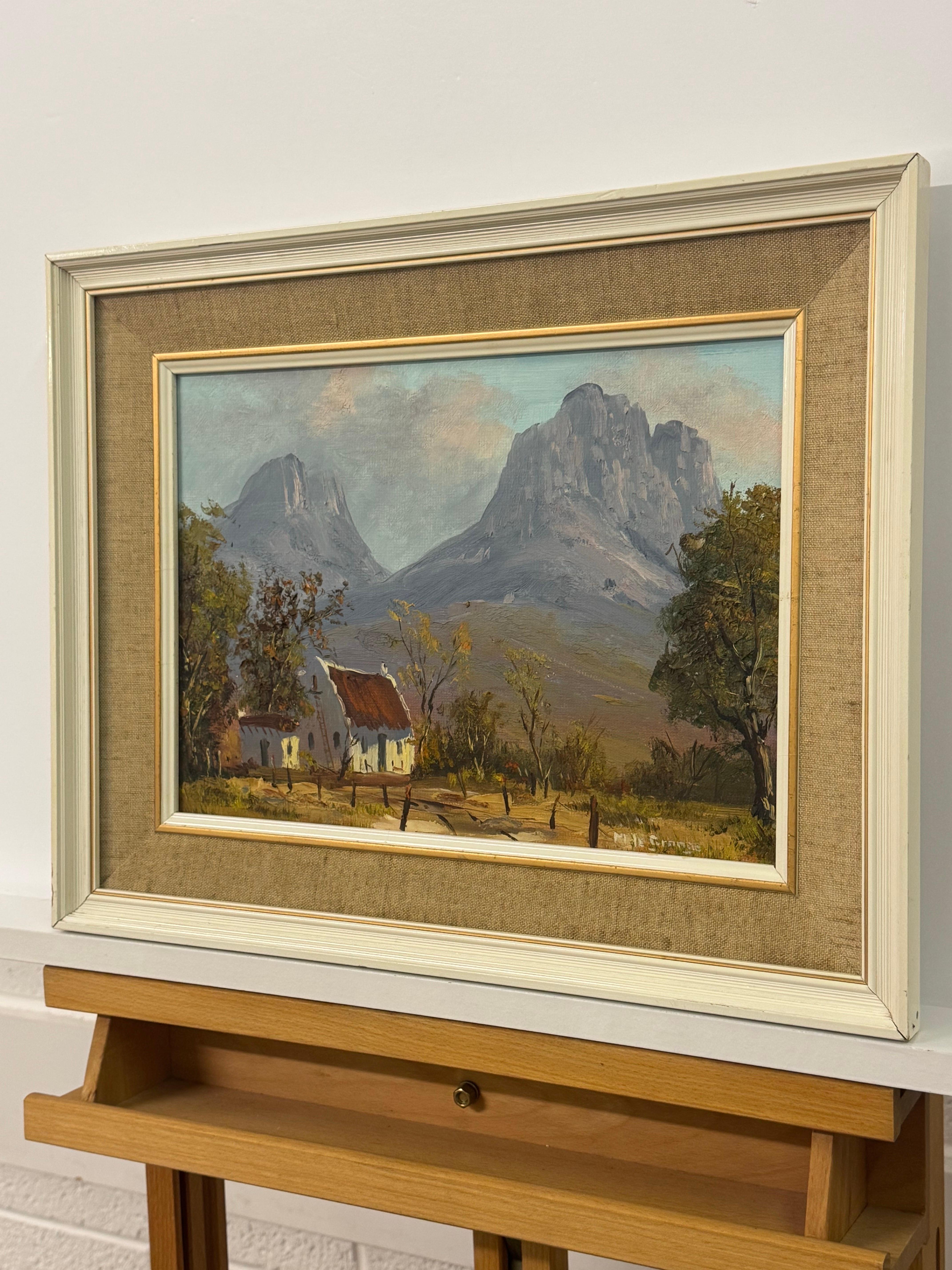 Pintura al óleo vintage de una cabaña remota en las dramáticas montañas de Sudáfrica - Landscape Painting Marrón de Marthinus la Grange