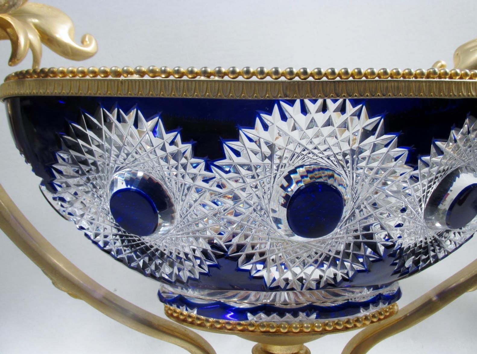 Luxury at its finest, a rarely seen Martin Benito fine and heavy cobalt blue cut to clear centerpiece bowl in a gilt bronze doré mount of swans and Baroque scrolls. Made in France, this piece measures 13.75” to top of swan handles, 19.25” at widest,