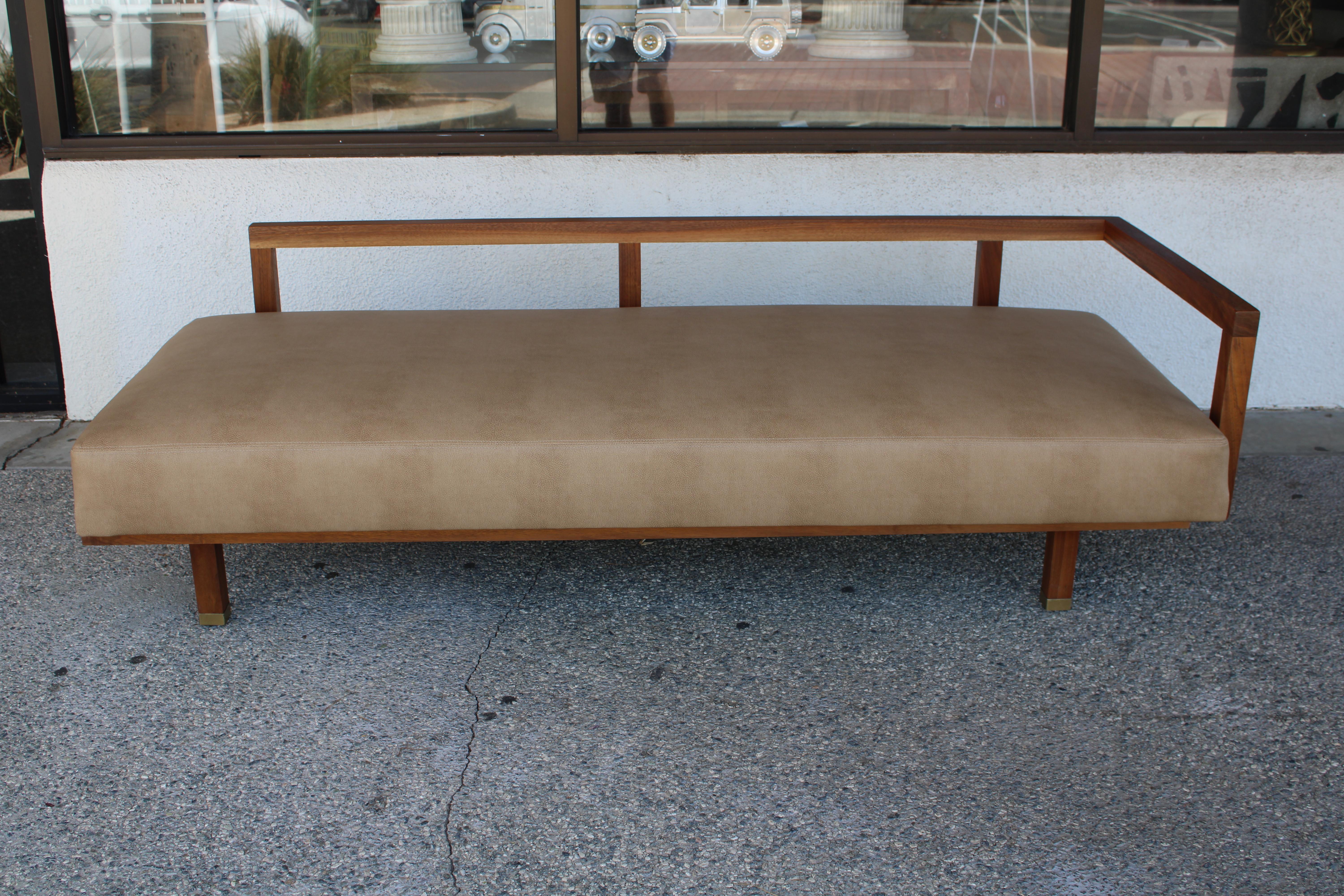 Articulating daybed created by Oakland Hills architect Martin Borenstein. This daybed allows the angle of the seat to adjust for seating or napping. A hinged walnut bar in the front allows you to lower the height by two inches. Made of solid walnut.