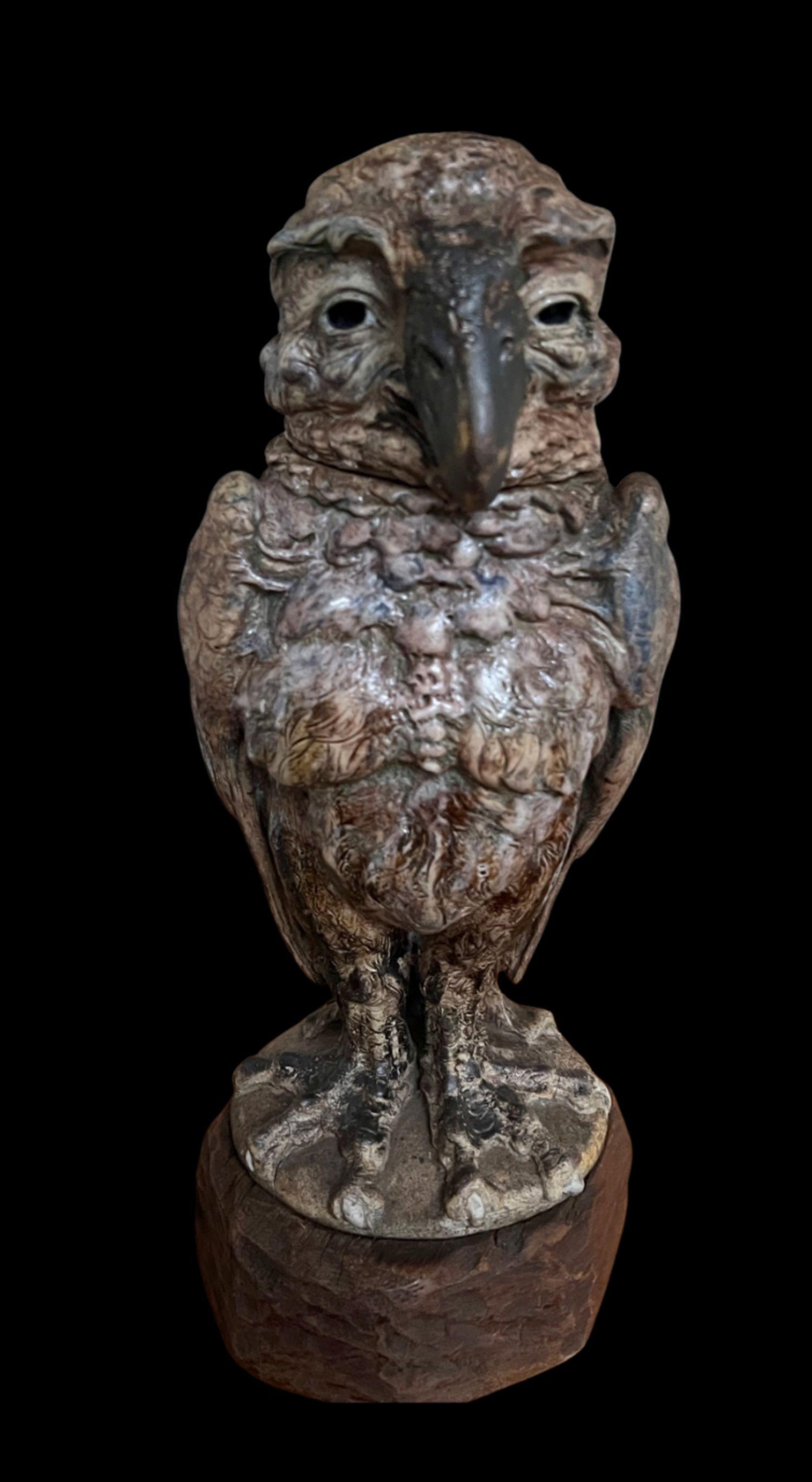 5232

Large Martin brothers bird by Robert Wallace Martin.

A well modelled example with a docile expression.

Dated 1912 and measuring 24cm high

Firing crack to base.