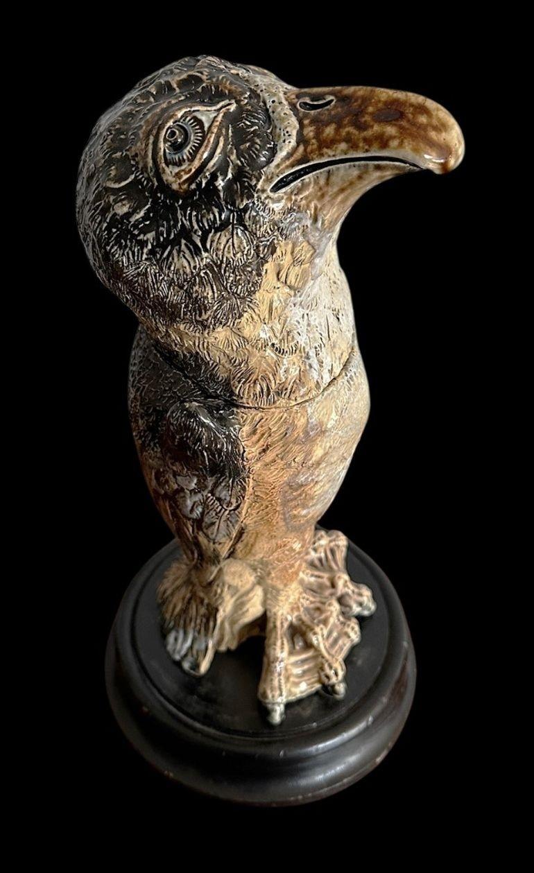 184
Large and Unusual Early Martin Brother’s Bird, with excellent modelling and defined tallons, head tilted back with a tan, brown and blue glaze.
The date is the bird is indistinct, but would date Circa 1880 with a fixed head.
Minor resotraiton to