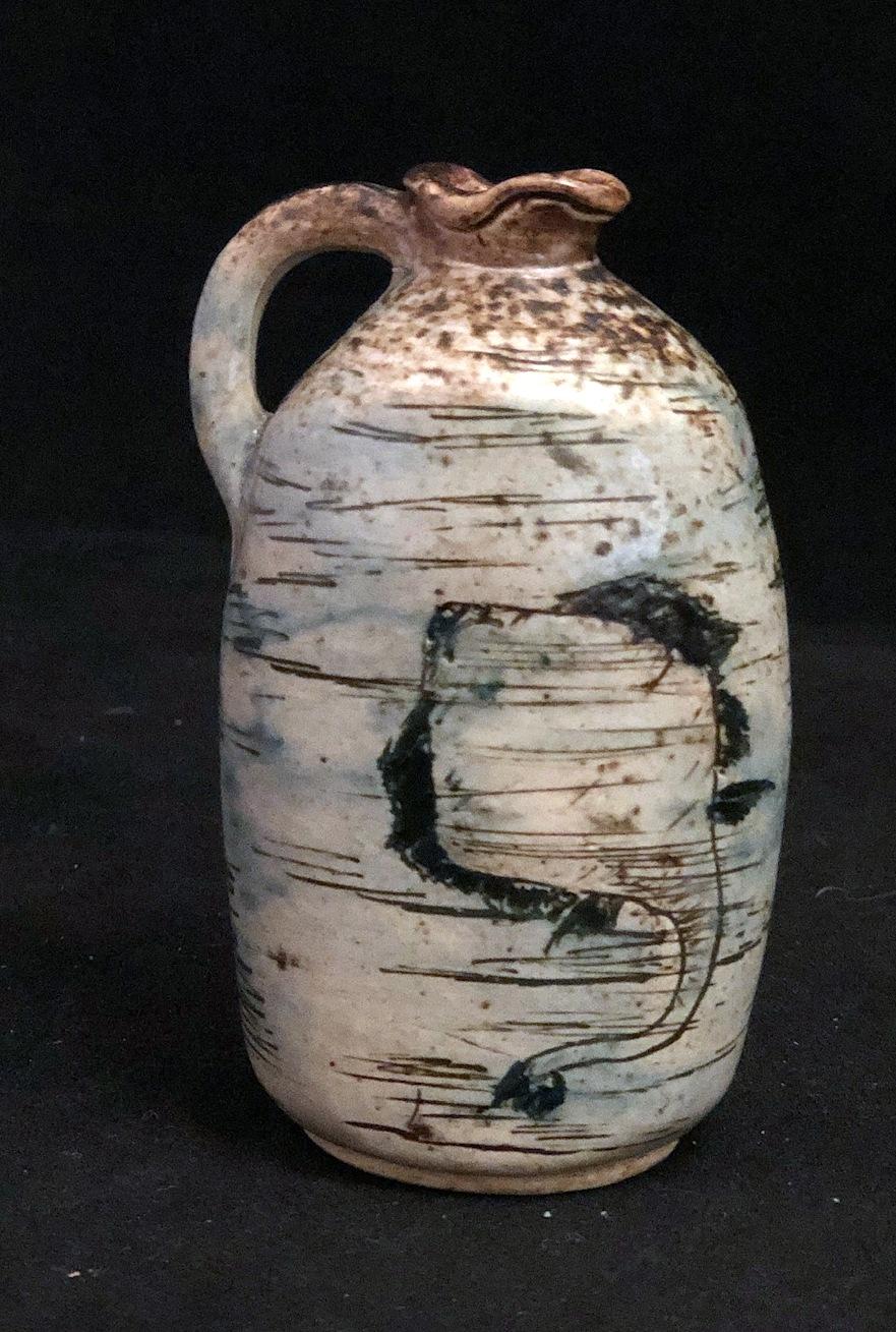 Martin Brothers Miniature Jug decorated with Grotesque Fish  
Undated but Circa 1900  
Provenance; Harriman Judd collection Sotheby's, New York 2001