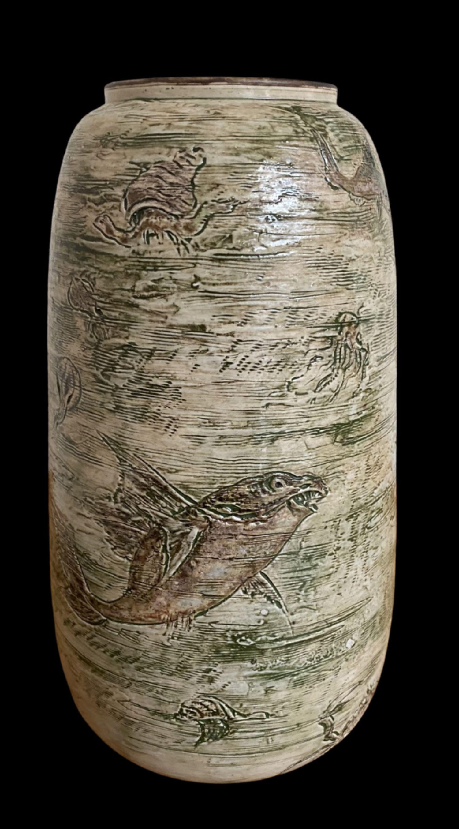 5095
Martin Brothers vase decorated with grotesque and comical fish, crabs, eel and squid. 
Small glaze frit to the rim.
Dated 1906.
