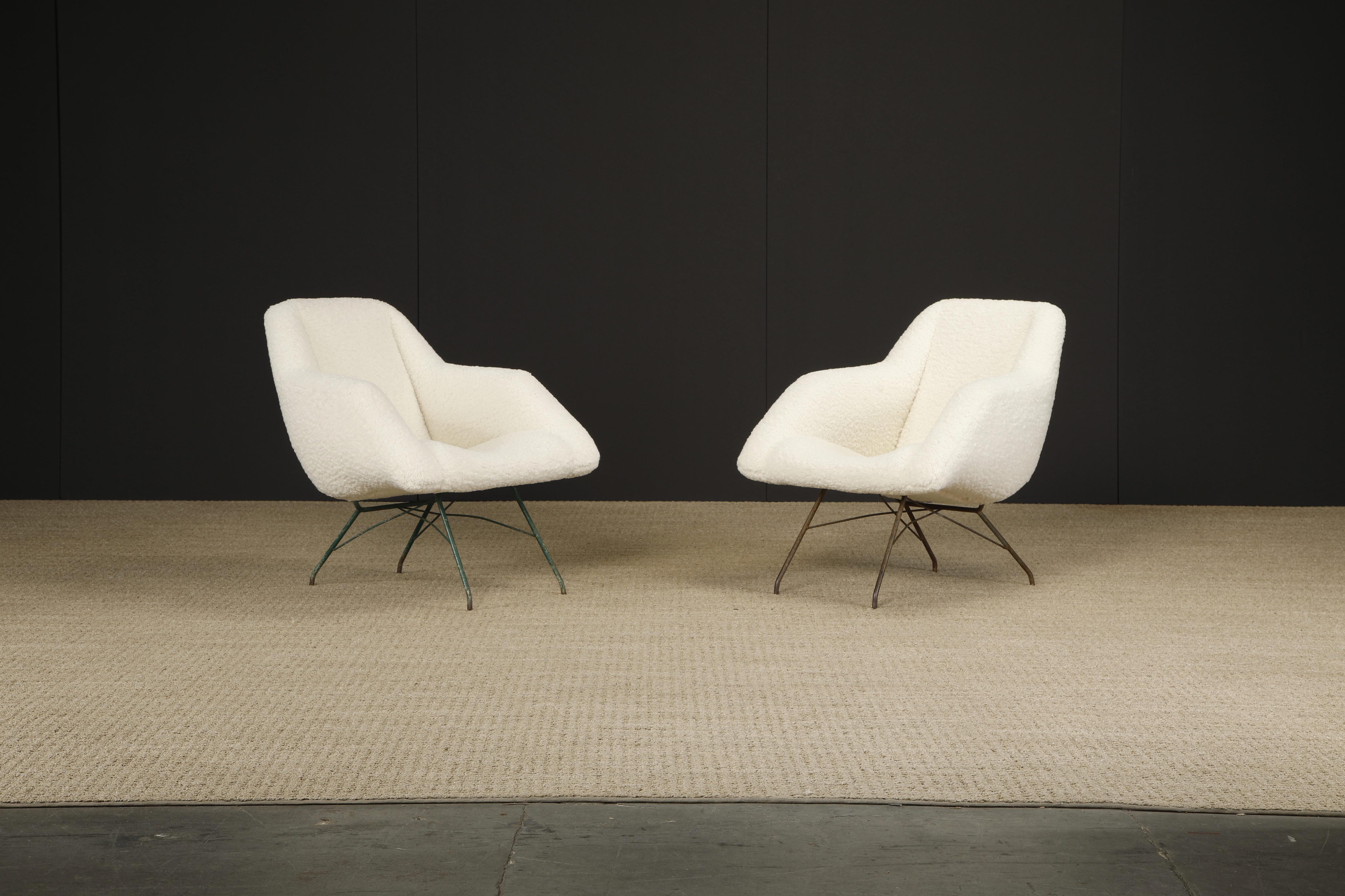 Beautifully reupholstered with soft nubby white bouclé, this pair of 'Concha' chairs by Martin Eisler and Carlo Hauner for Forma, Brazil, encapsulates the quality and innovation of their designs. This elegant scoop chair with its slightly reclined