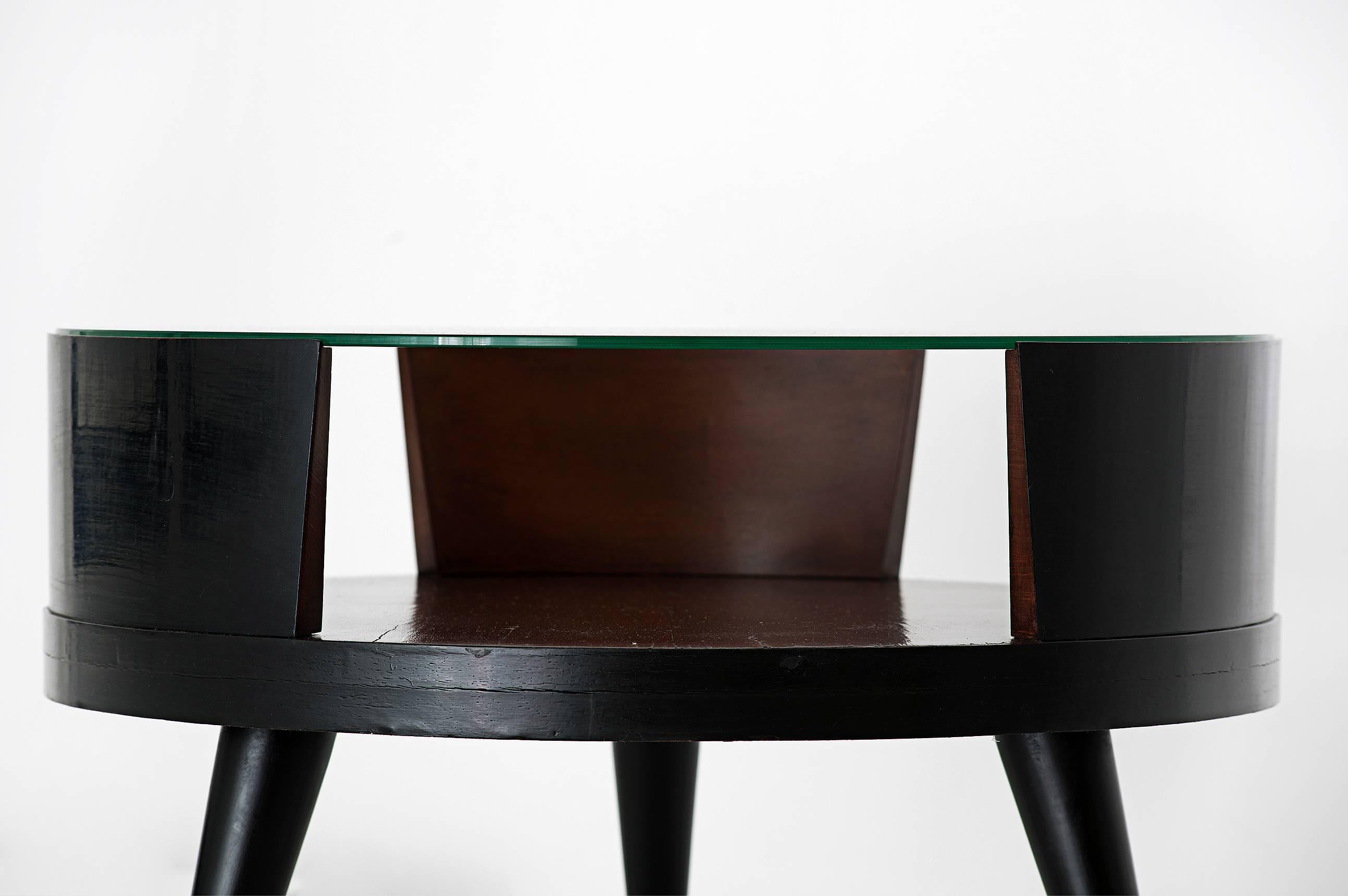 Martin Eisler (1913-1977) & Carlo Hauner (1927-1997)

Coffee table
Manufactured by Forma Moveis
Brazil, 1950s
Ebonized wood, glass top
Midcentury design Brazilian coffee table. 

Measurements
60 cm diameter x 49 height cm.
23.50 in