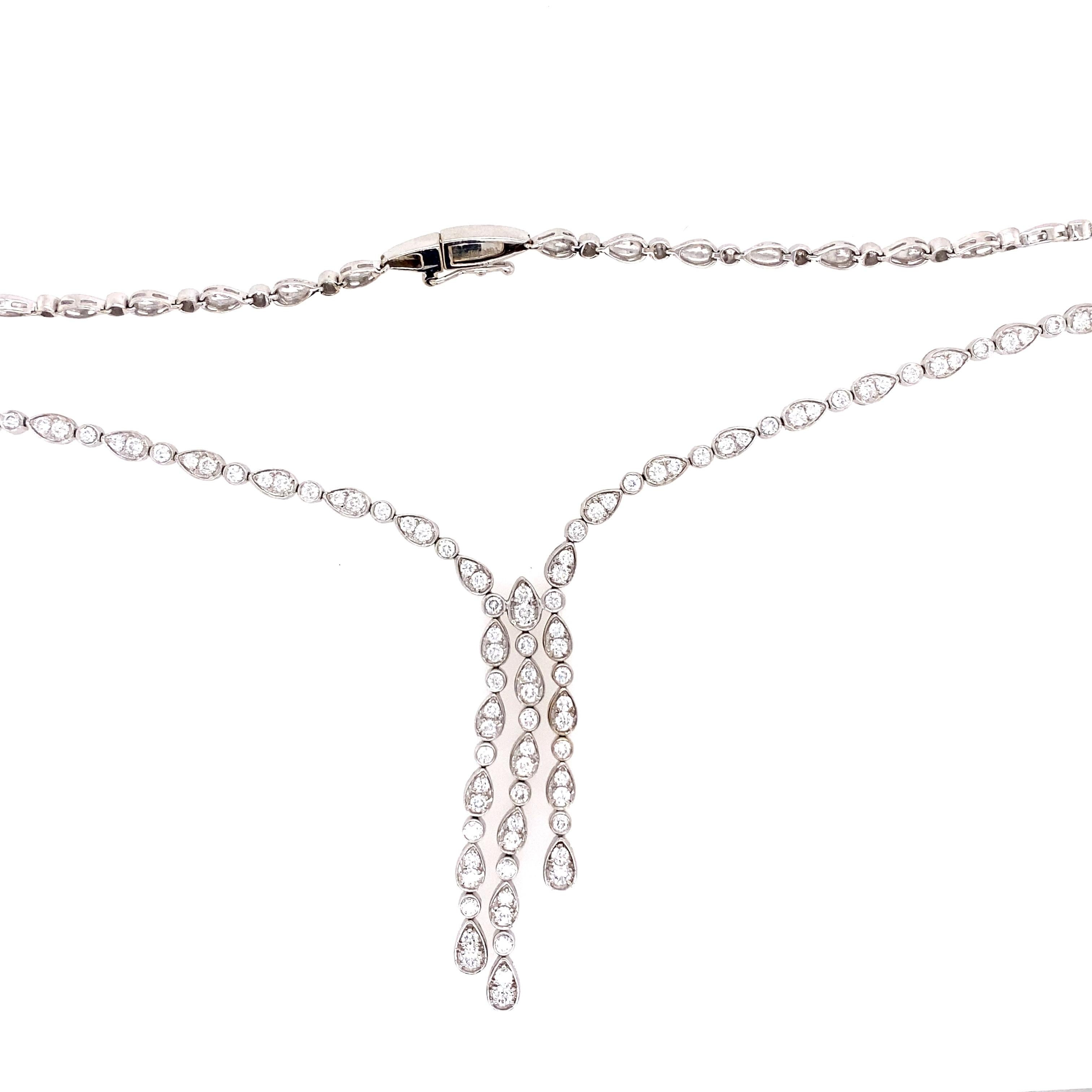 One estate 18 karat white gold diamond (stamped 18K MF) necklace by Martin Flyer bead set with one hundred and three round brilliant diamonds, 2.30 carats total weight with matching H/I color and VS2/SI1 clarity. The necklace measures 15 inches in