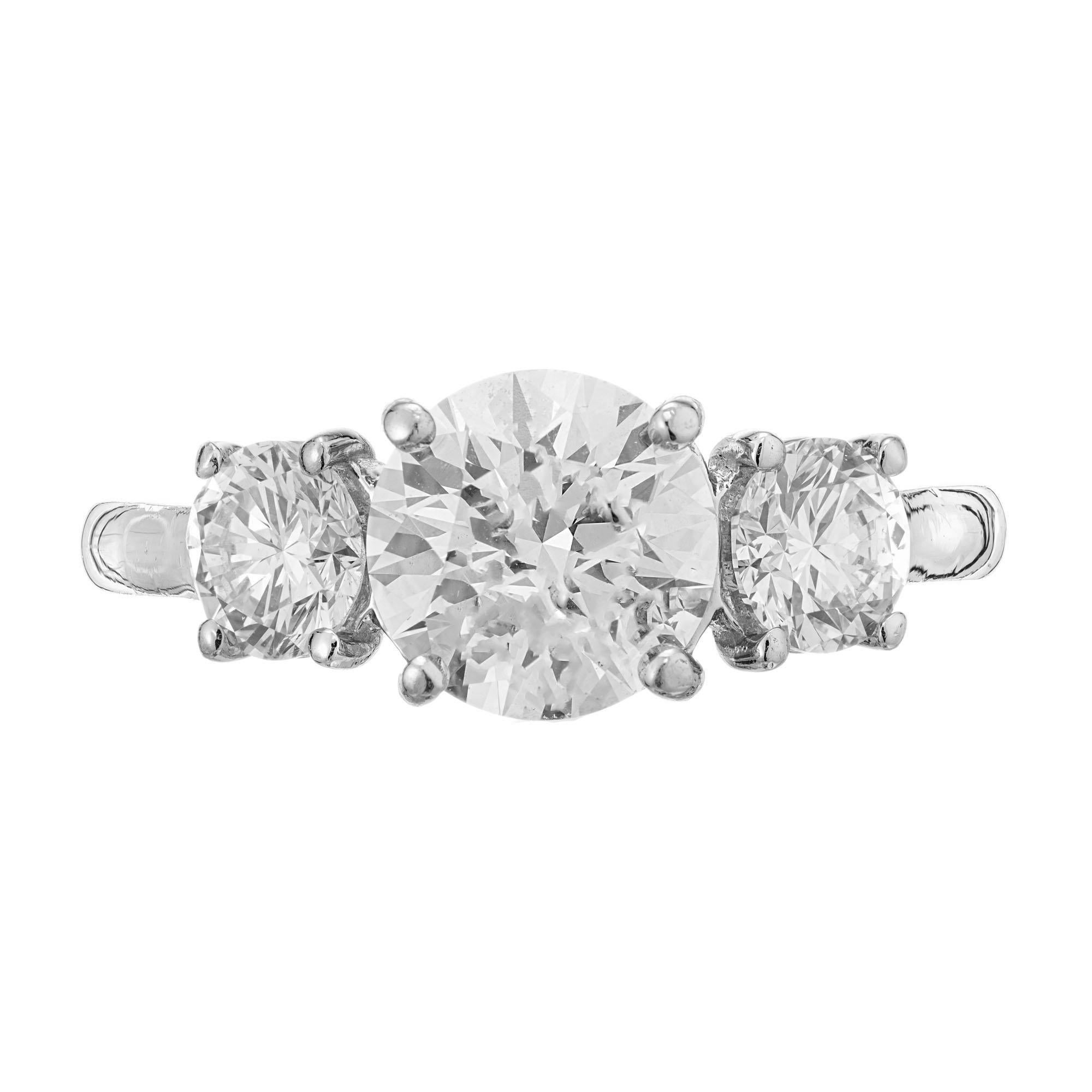 Martin Flyer handmade Diamond engagement Platinum ring. GIA certified round ideal brilliant cut center stone with 2, round ideal brillaint cut side stones in a three-stone platinum setting. 

One diamond approx. total weight 1.52cts, round Ideal
